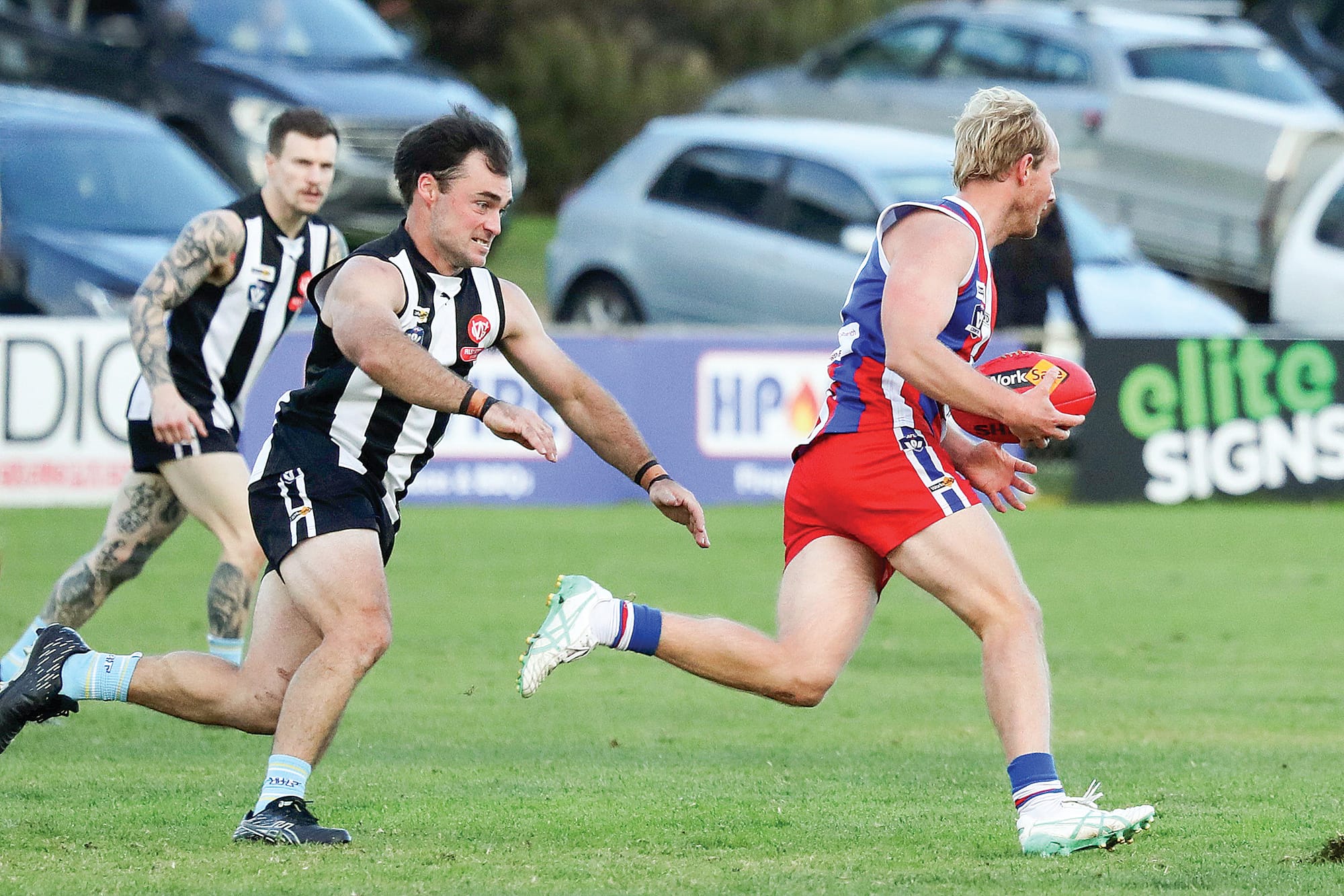 Marcus Wright streams past his Dalyston opponent Robert Davey. 