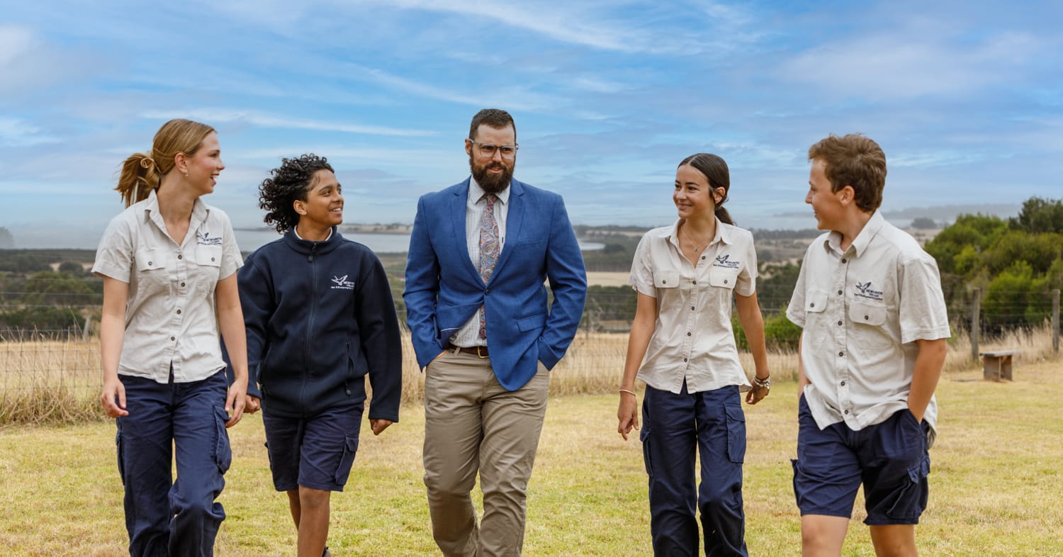 Head of Year 9 Sam Foura (centre) with current Year 9 students Myka Sylvio, Ellie Hennessy, Amelia Raso and Kai Cashman.