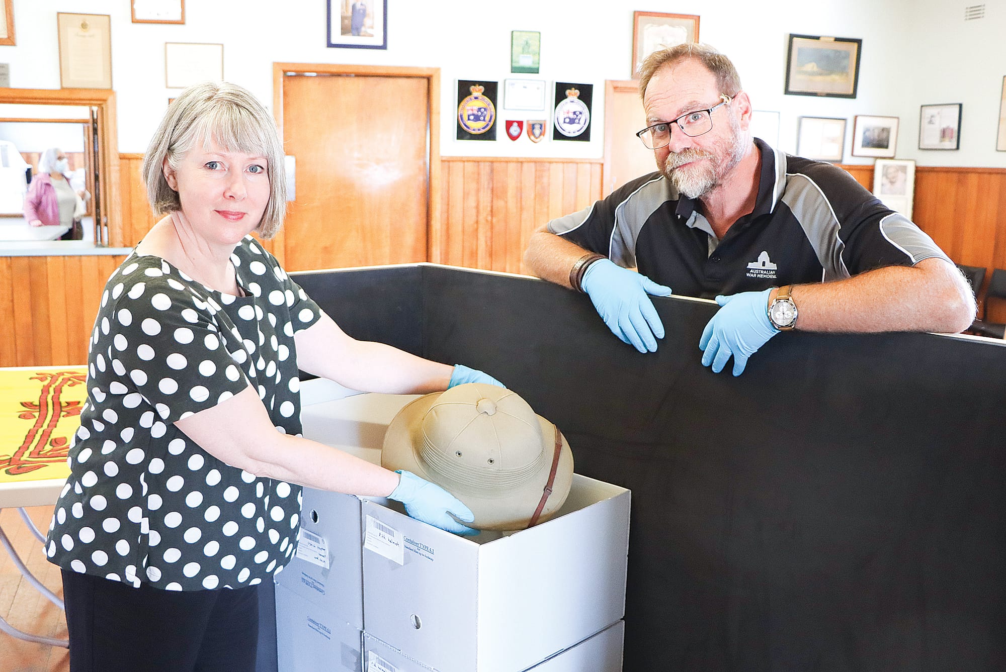 Michelle Newton-Edwards and Jason d’Arx of the Australian War Memorial are impressed with the diversity of the Paterson collection which the AWM team sorted and packed for safe transportation to the ACT. A04_0925
