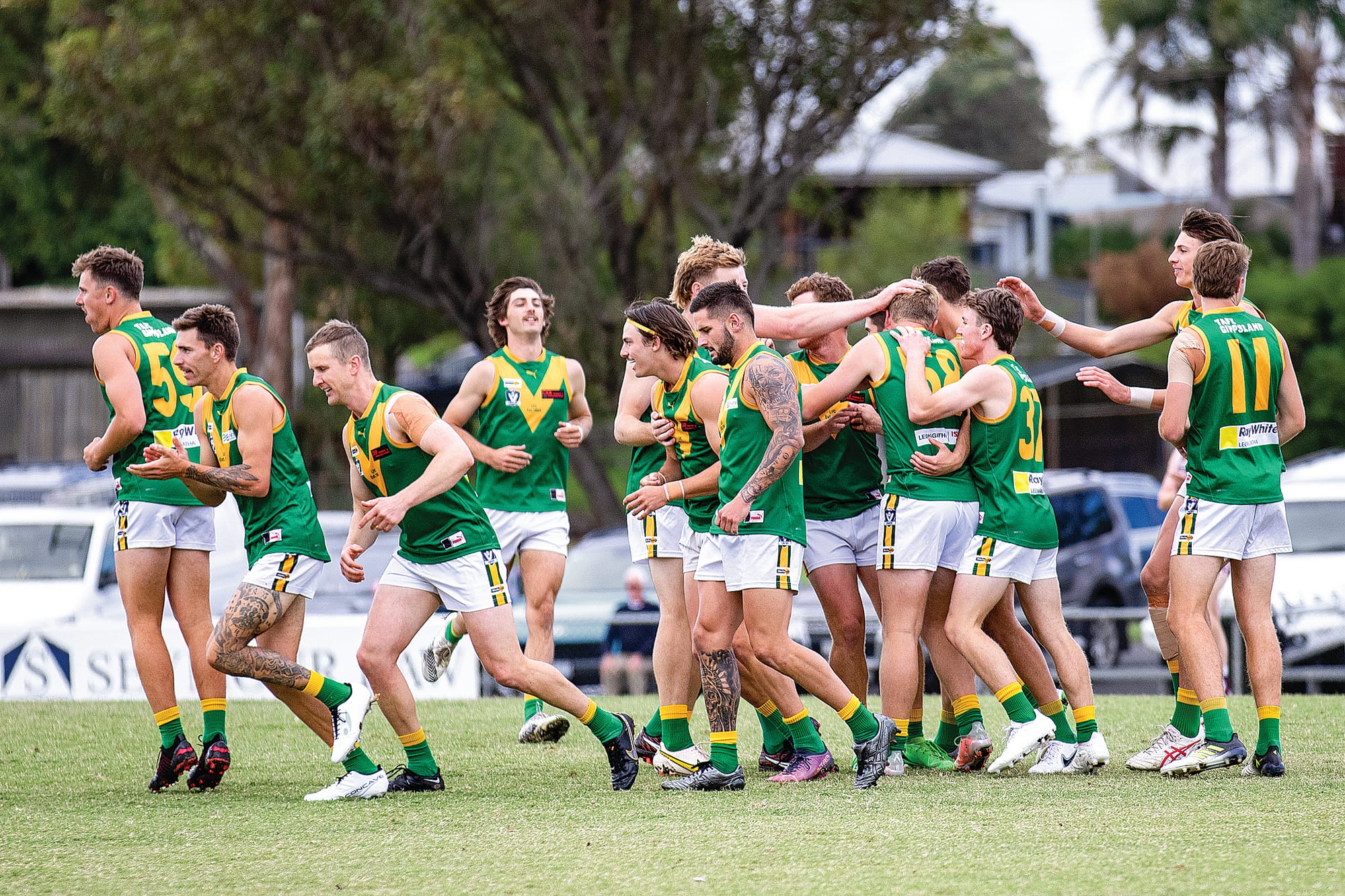 The Parrots celebrate after a dominating match against Traralgon.