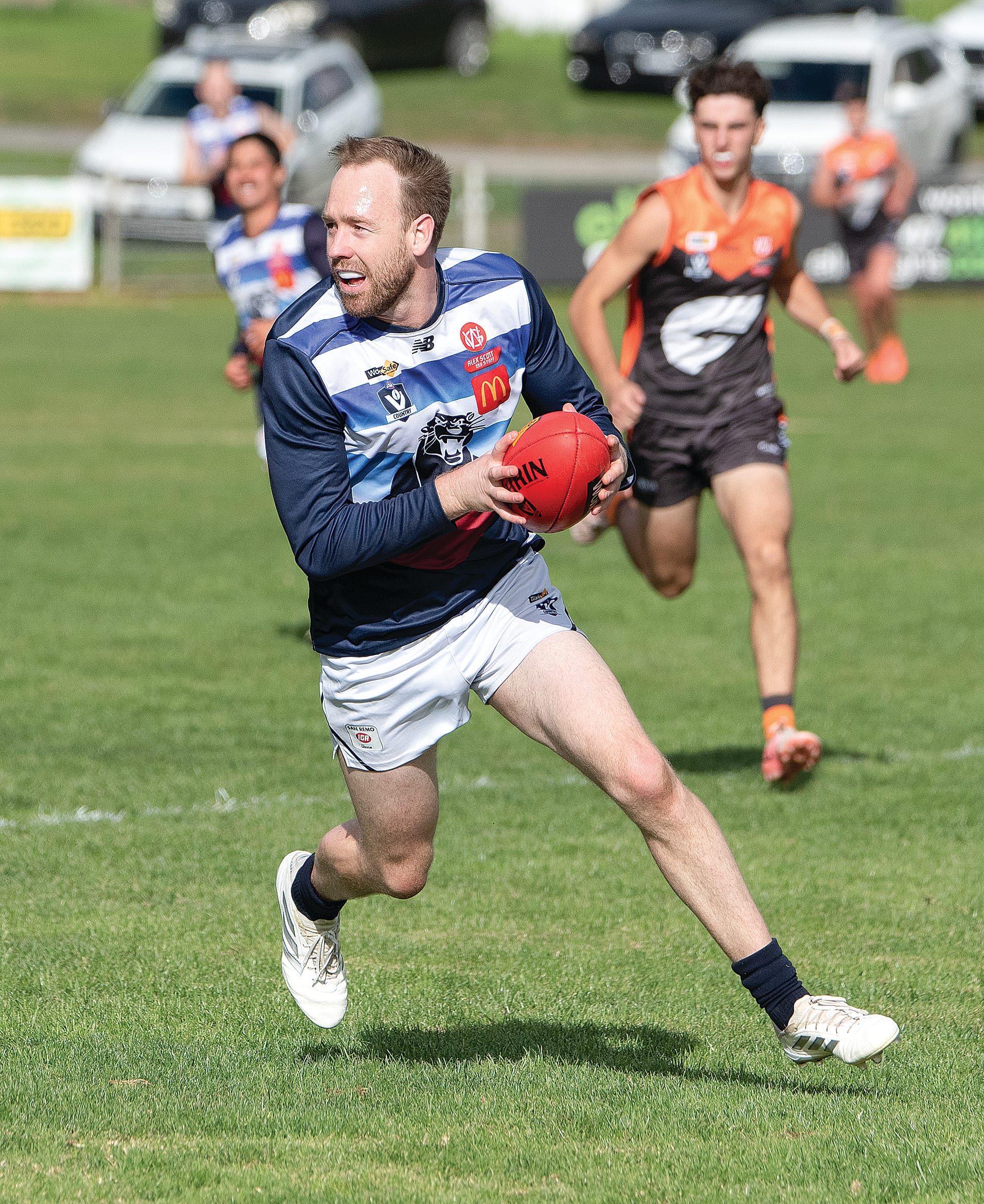 Dale Gawley runs clear and looks for options to deliver the ball forward for Kilcunda Bass.