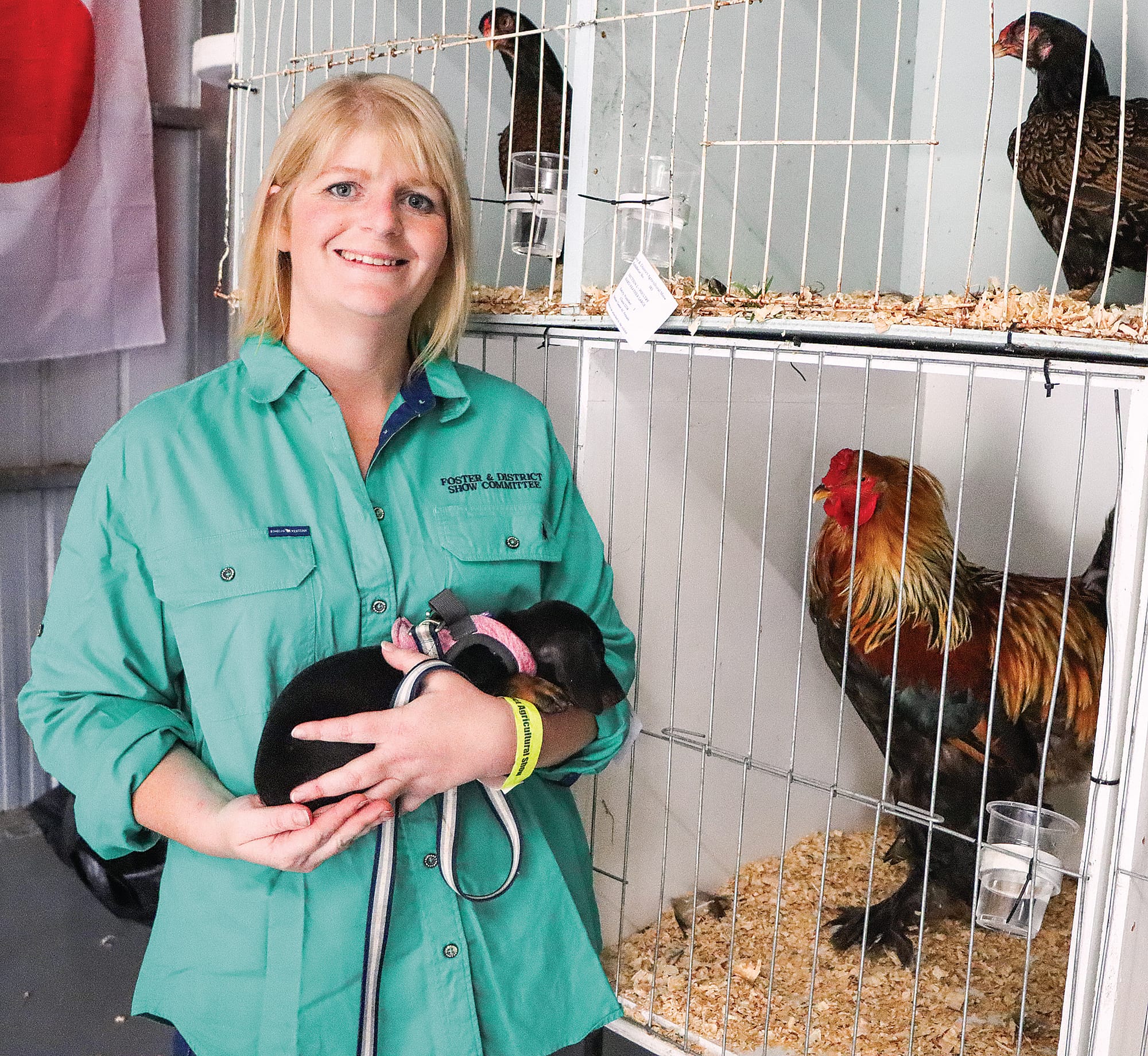 Kara Oxley with puppy Daisy and the family’s Partridge Brahma rooster. A10_0924