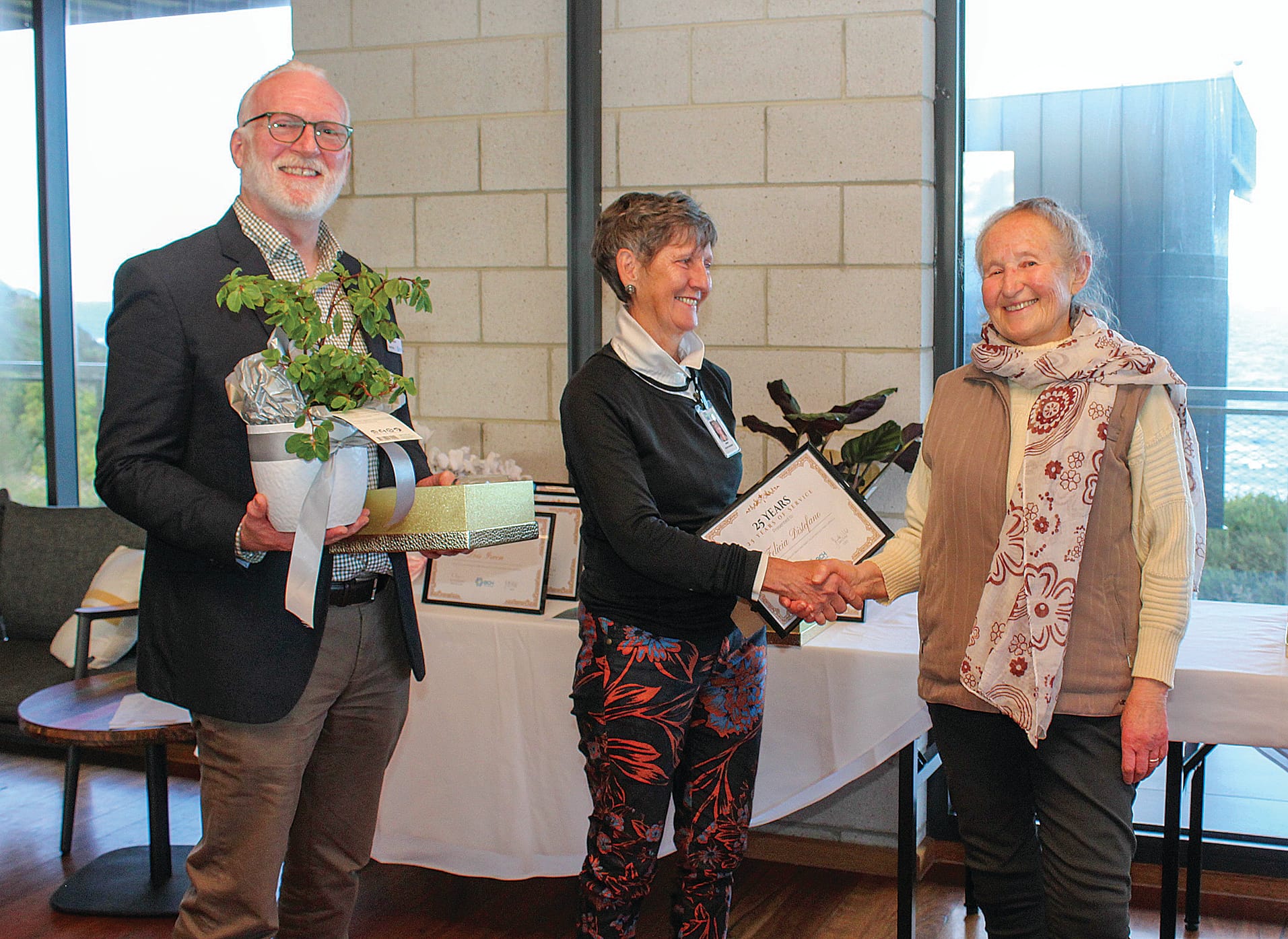 Felicia Di Stefano, right, is thanked for her 25 years of service by Bass Coast Health Board Chair Ian Thompson and Board Member Mary Whelan.