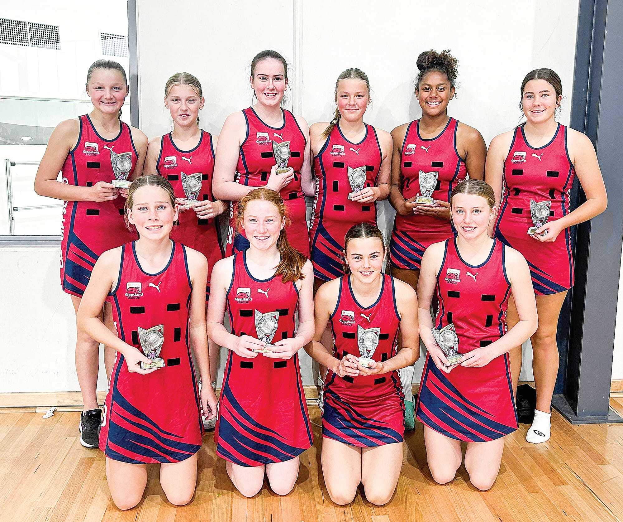 Gippsland League players enjoy the moment after seeing off Ellinbank and District Football Netball League in the Under 13s Open section. 