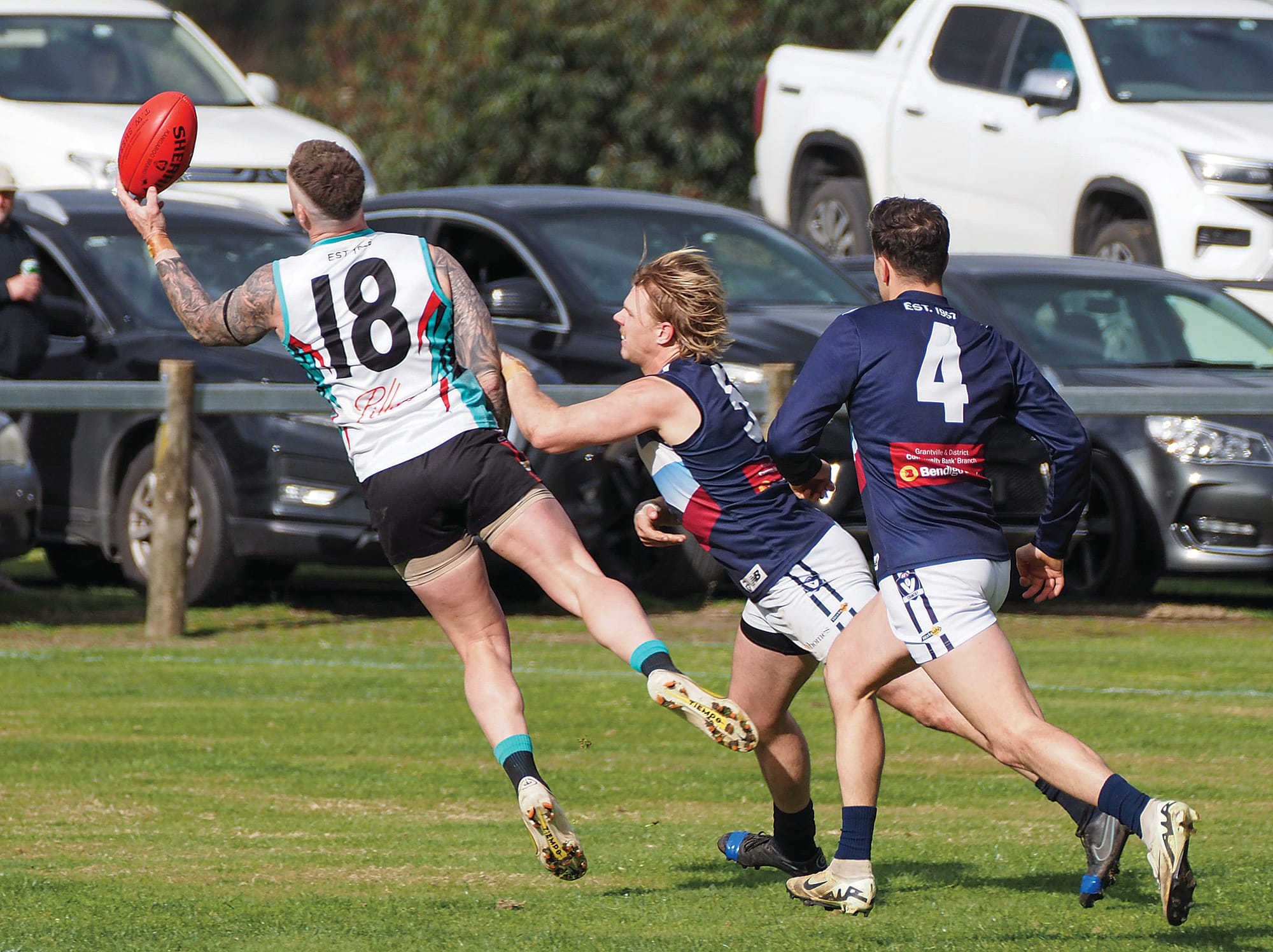 Lochlan Scott and Anthony Daraio hot on the heels of Nathan Gardiner. Photo: Rob Gardiner.