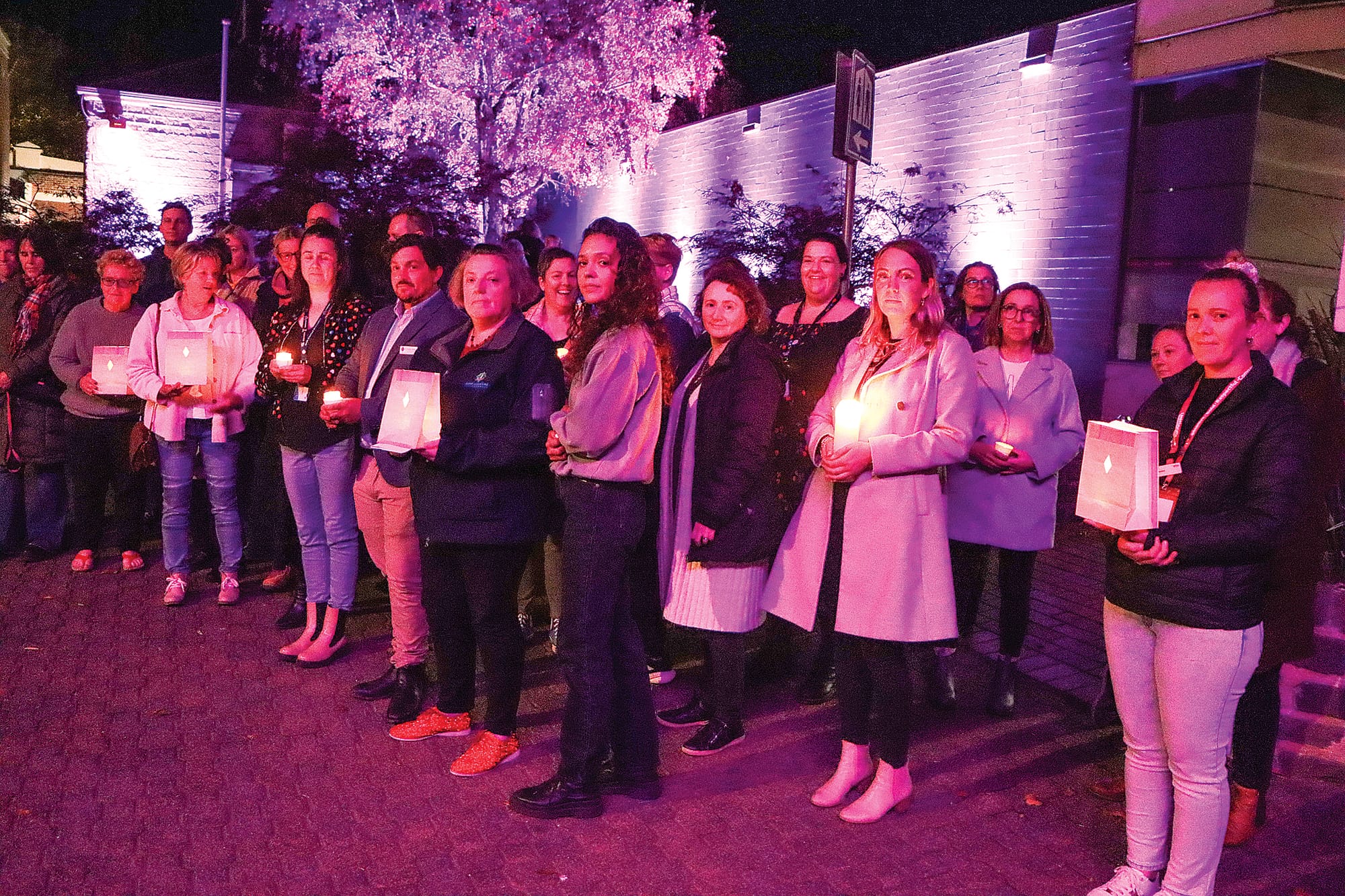 Vigil attendees in Leongatha contemplate the loss of lives resulting from family violence and call for positive change. A11_1924