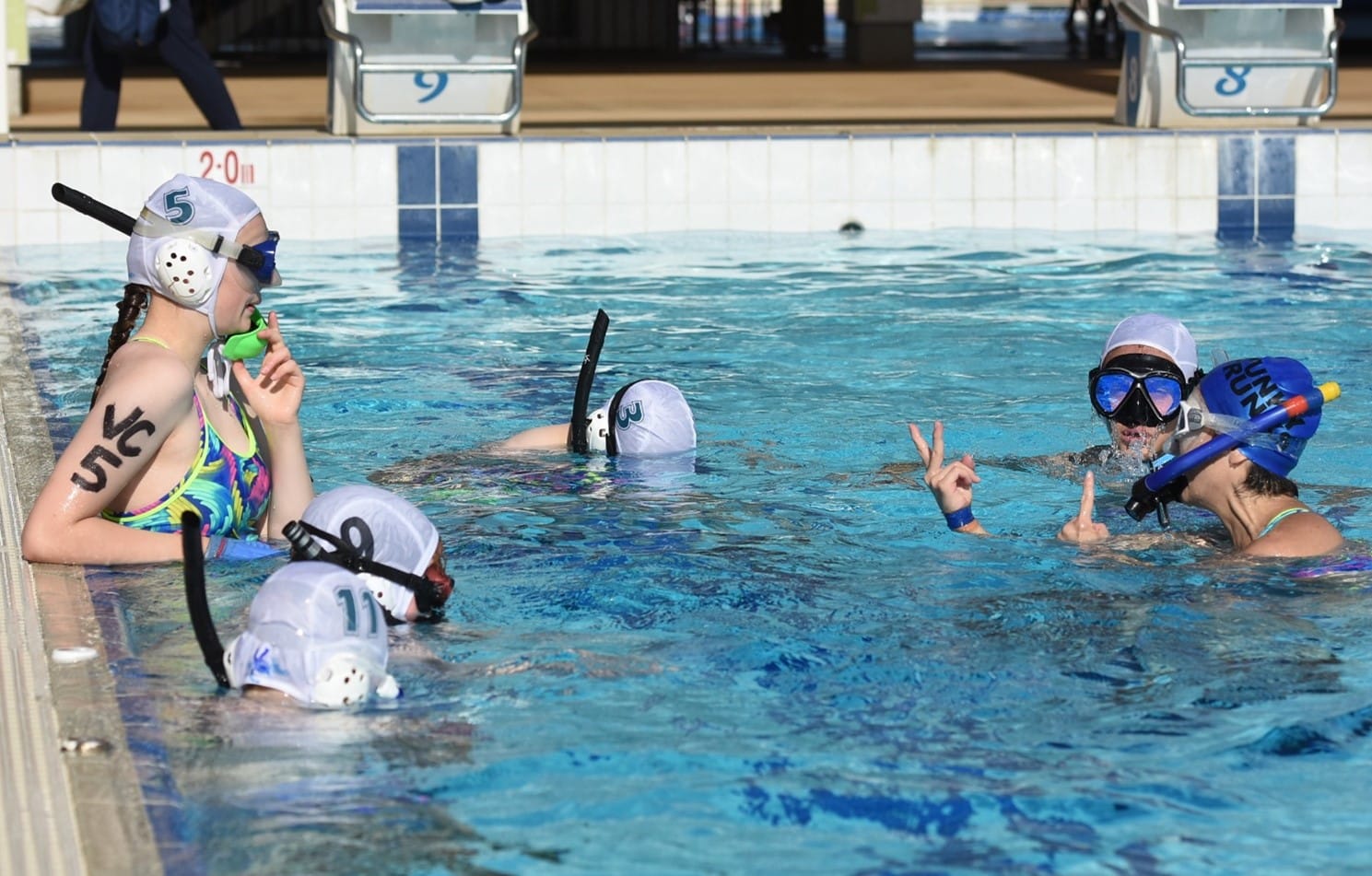Coach Lucy addressing the team.