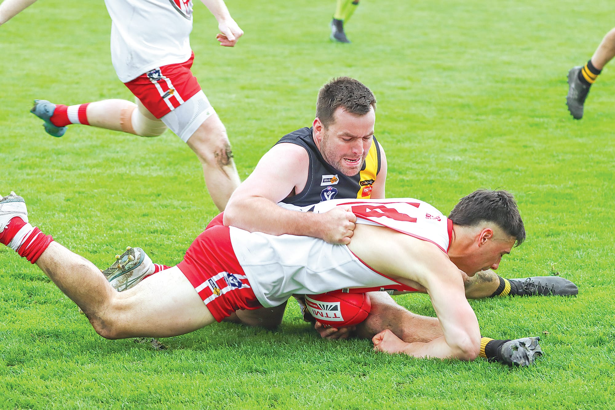 Best on Ground Josh Toner lays a tackle on Fish Creek’s Josh Standfield, Toner’s defensive pressure and composure for the Tigers being instrumental in ending the Kangaroos’ three-peat hopes. A31_3725