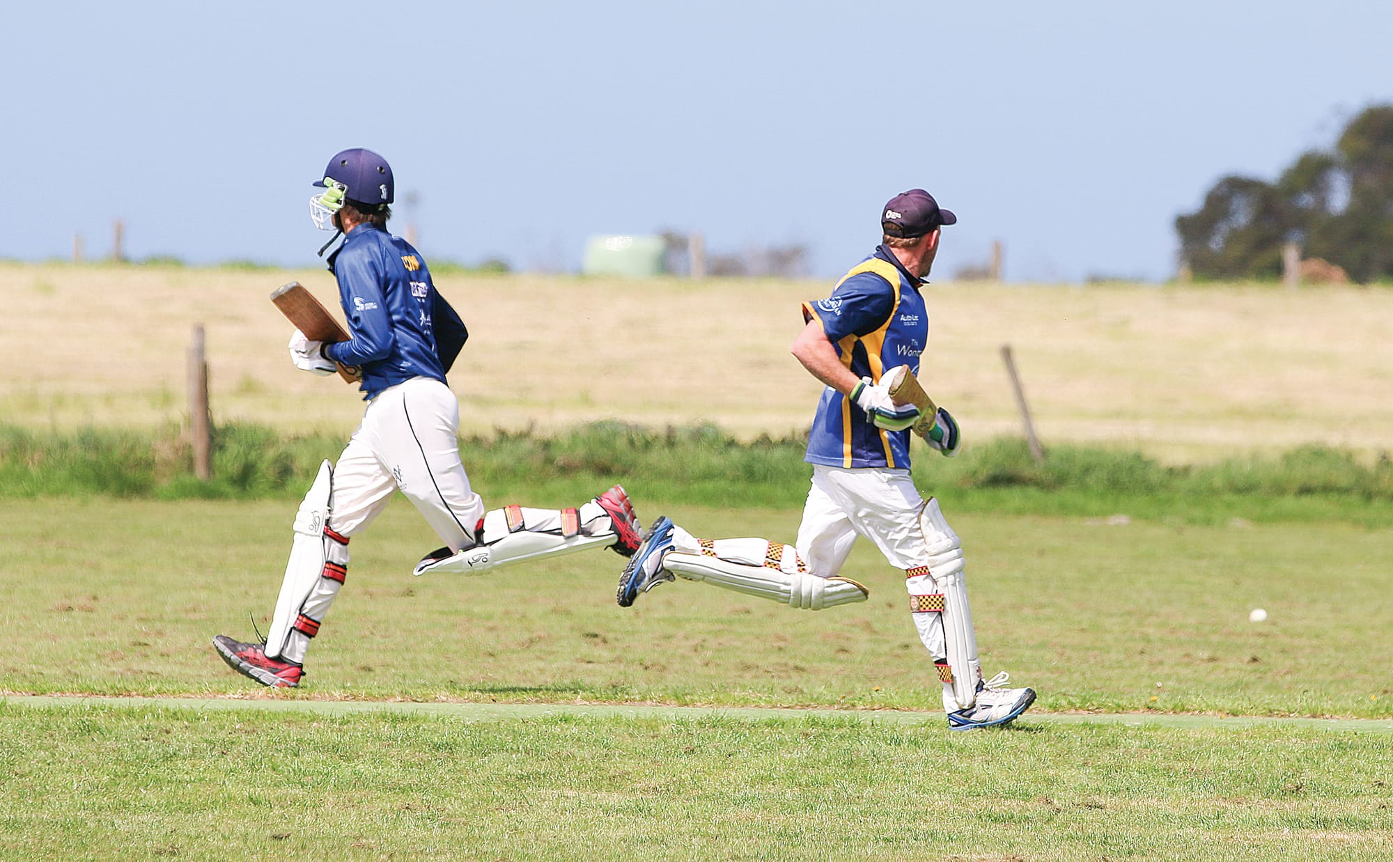 Club’s Matt Sharp and Lucas Ton go for a run against OMK in C1. Tk19_4224