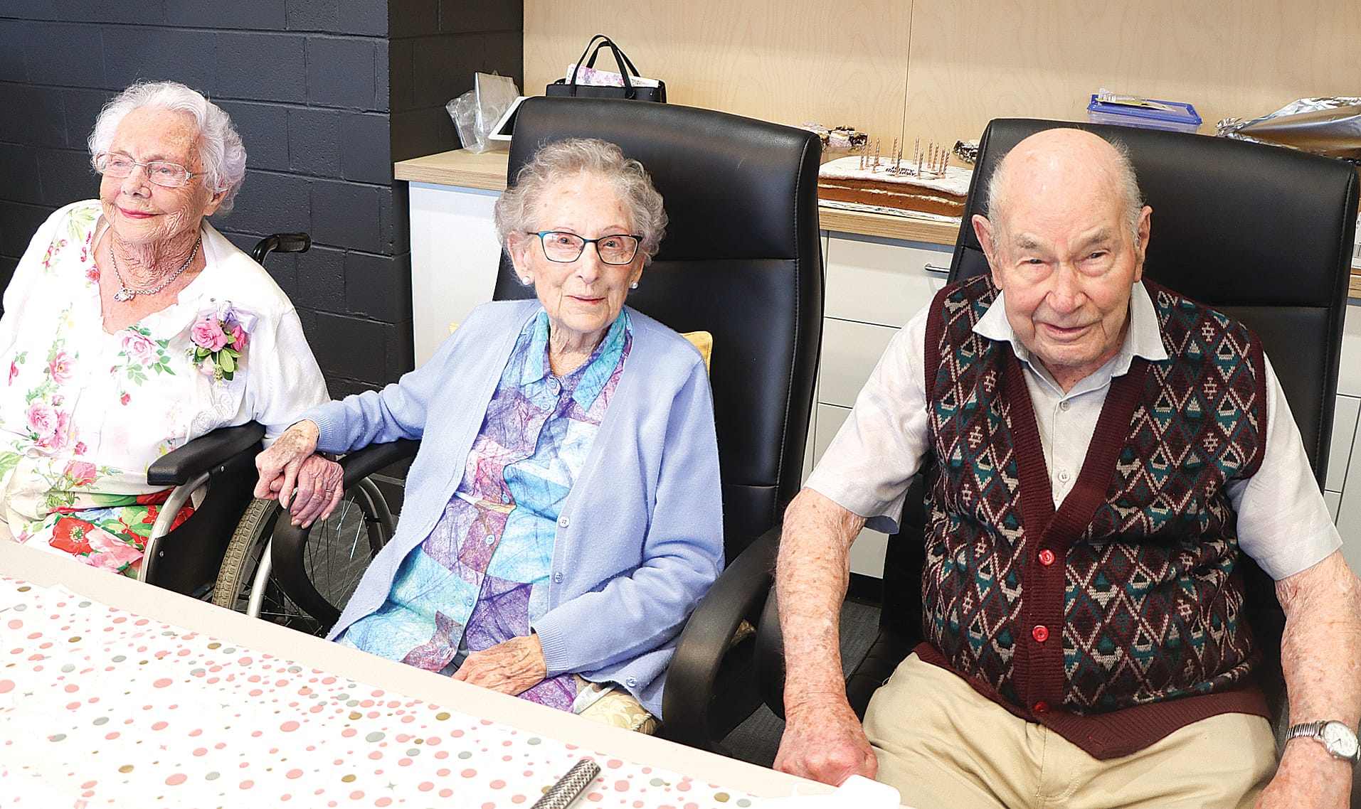 Carinya Lodge’s centenarians Flo Cooper, Topsie Cairns and Bob Olney at Flo’s 105th birthday. A02_1124
