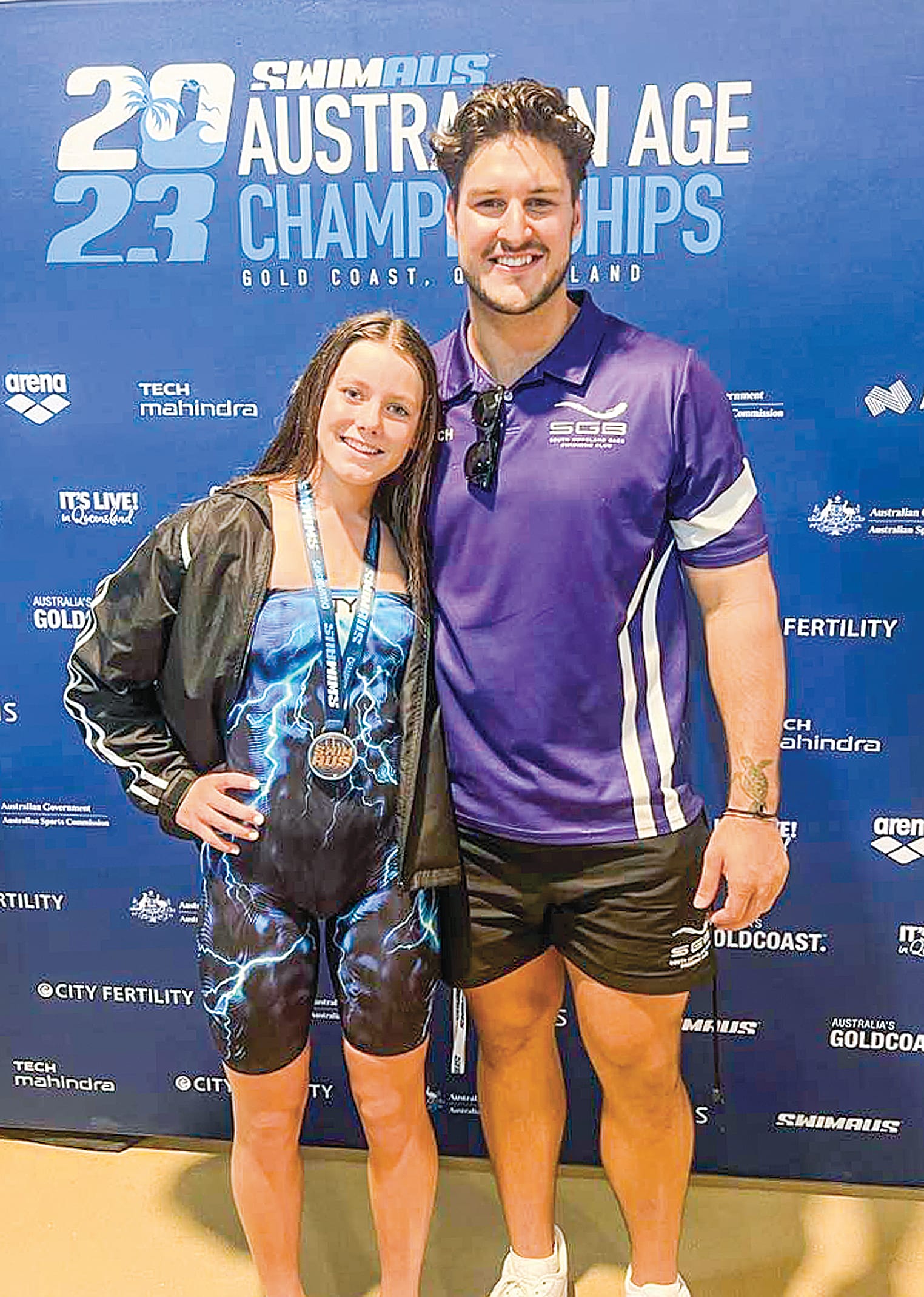 Olivia and coach Caiden celebrate her bronze medal.