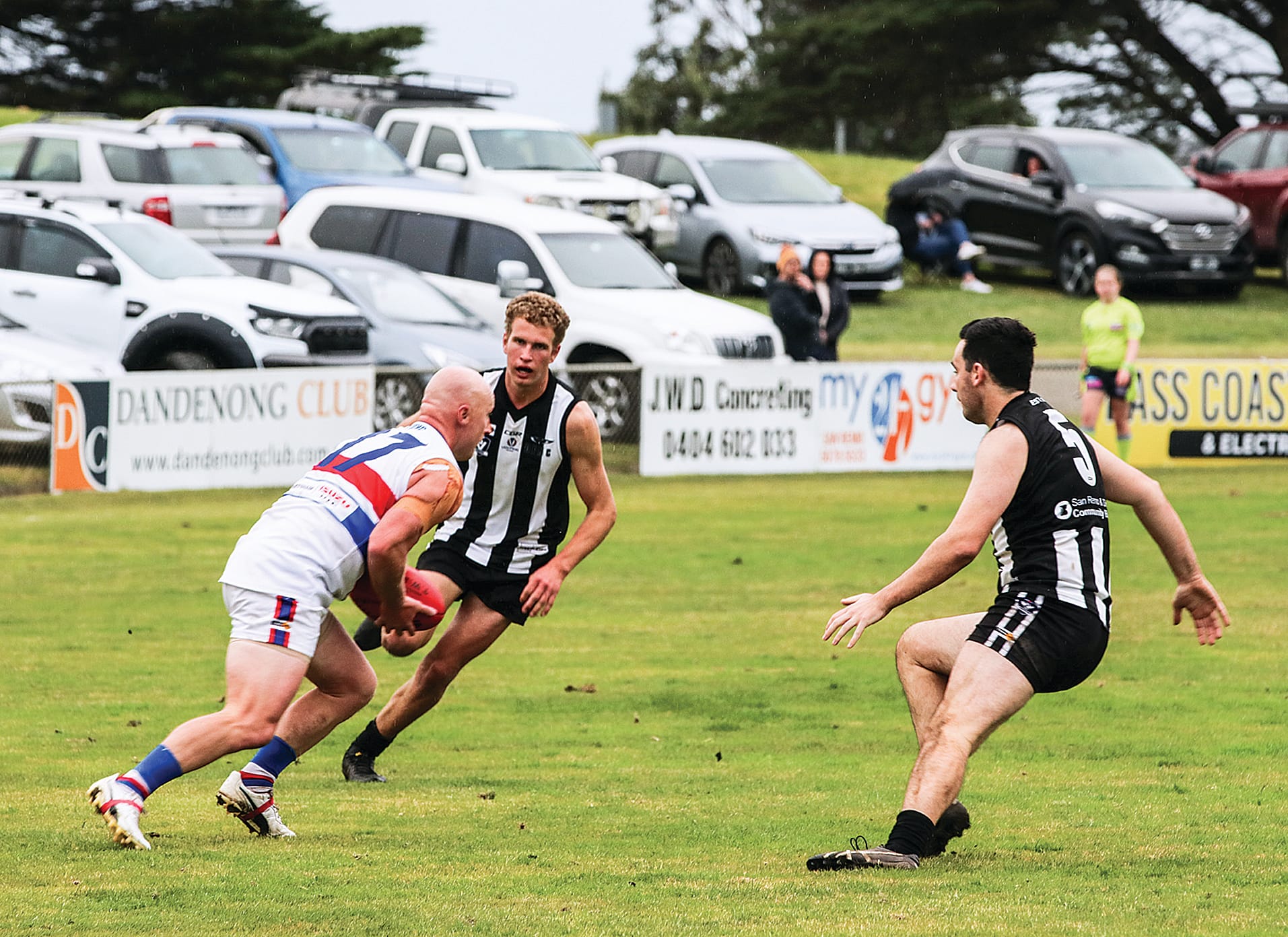Phillip Island’s Zach Wagner prepares to elude Dalyston’s Brad Monson and Clay Tait in the second quarter. Z38_3022