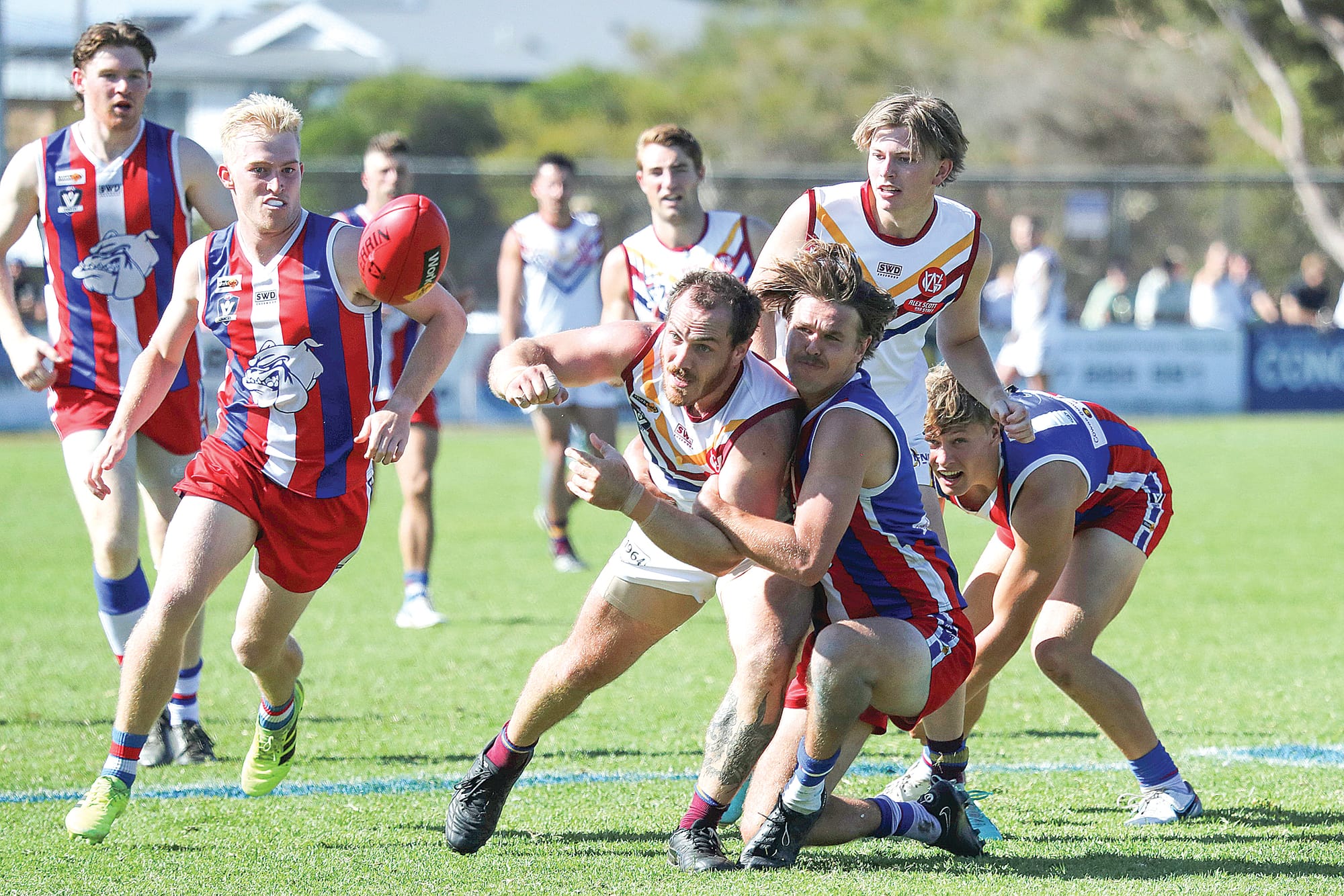 Billy Taylor takes down Industrial’s Nic Visser with Hayden Bruce ready to pounce. Photo: Carol Ratcliff.