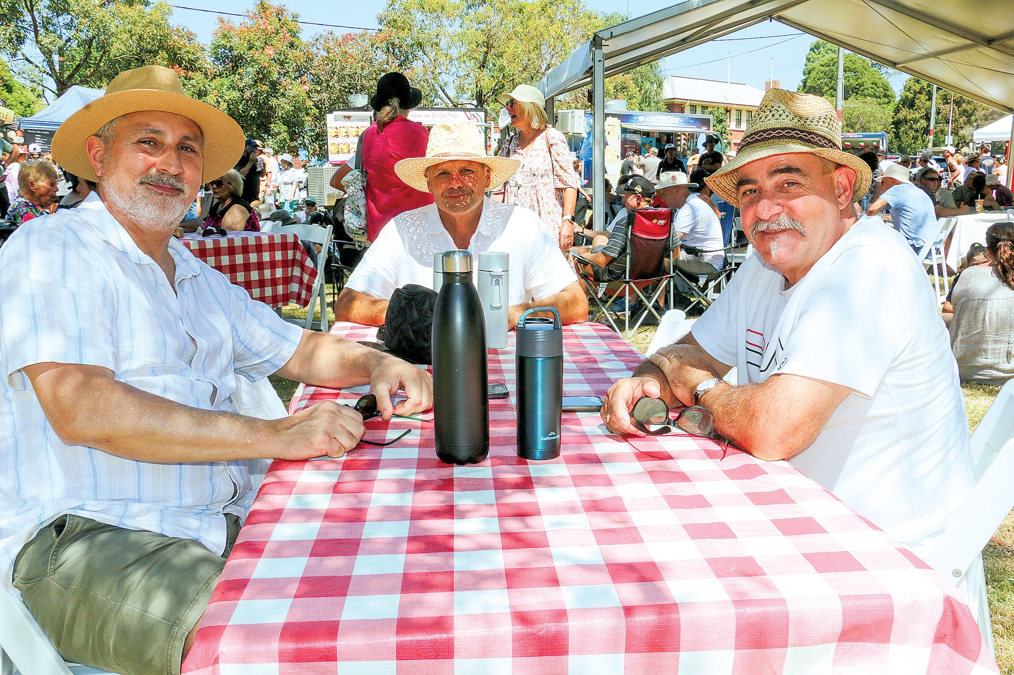 Frank Petrolo, Paul Rischitelli and Robert Formoso were in high spirits celebrating the best of Italy in Mirboo North on Sunday.