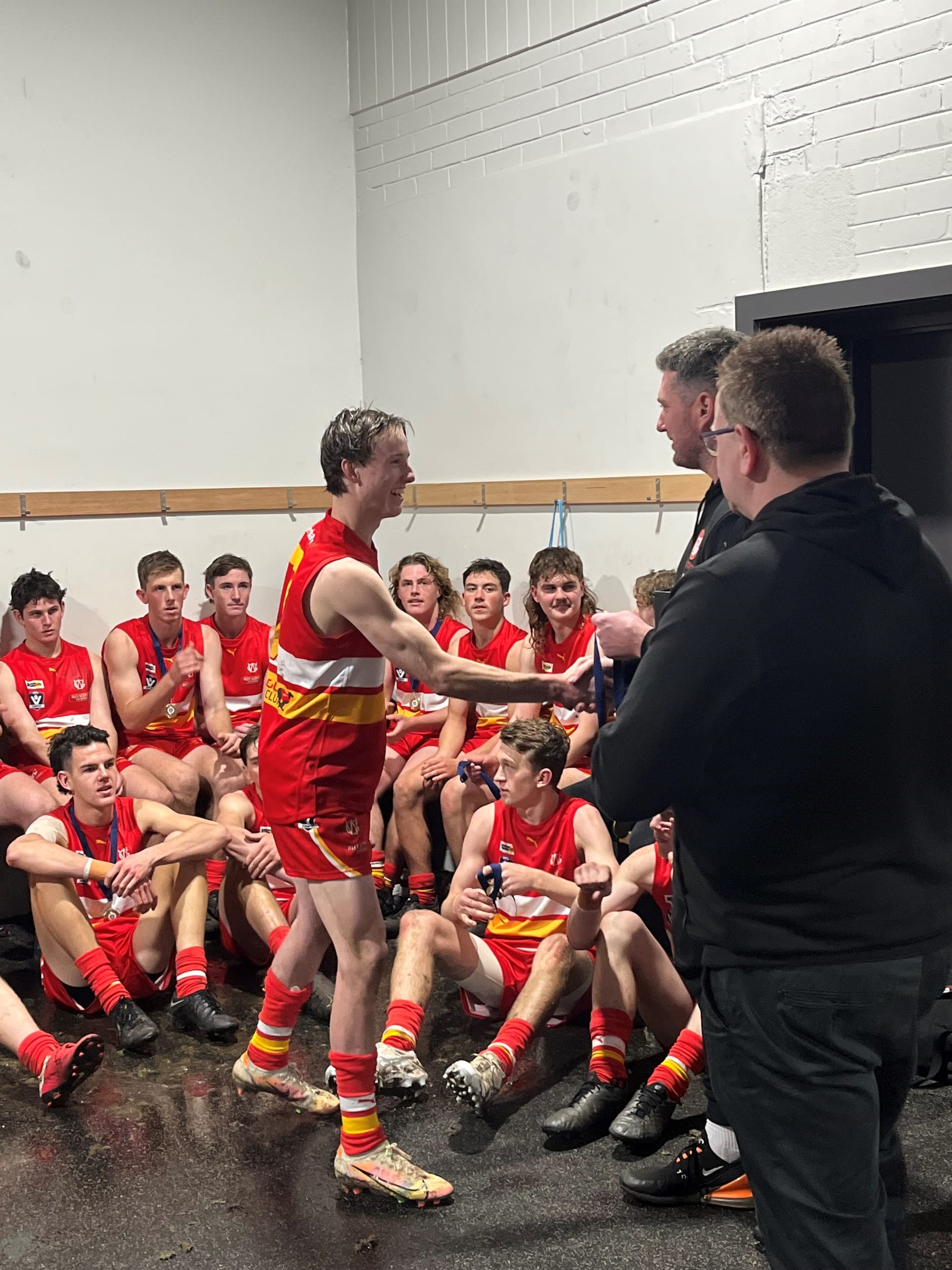 Tully Dickie from Phillip Island receives his medal for best on ground in the Grand Final. 