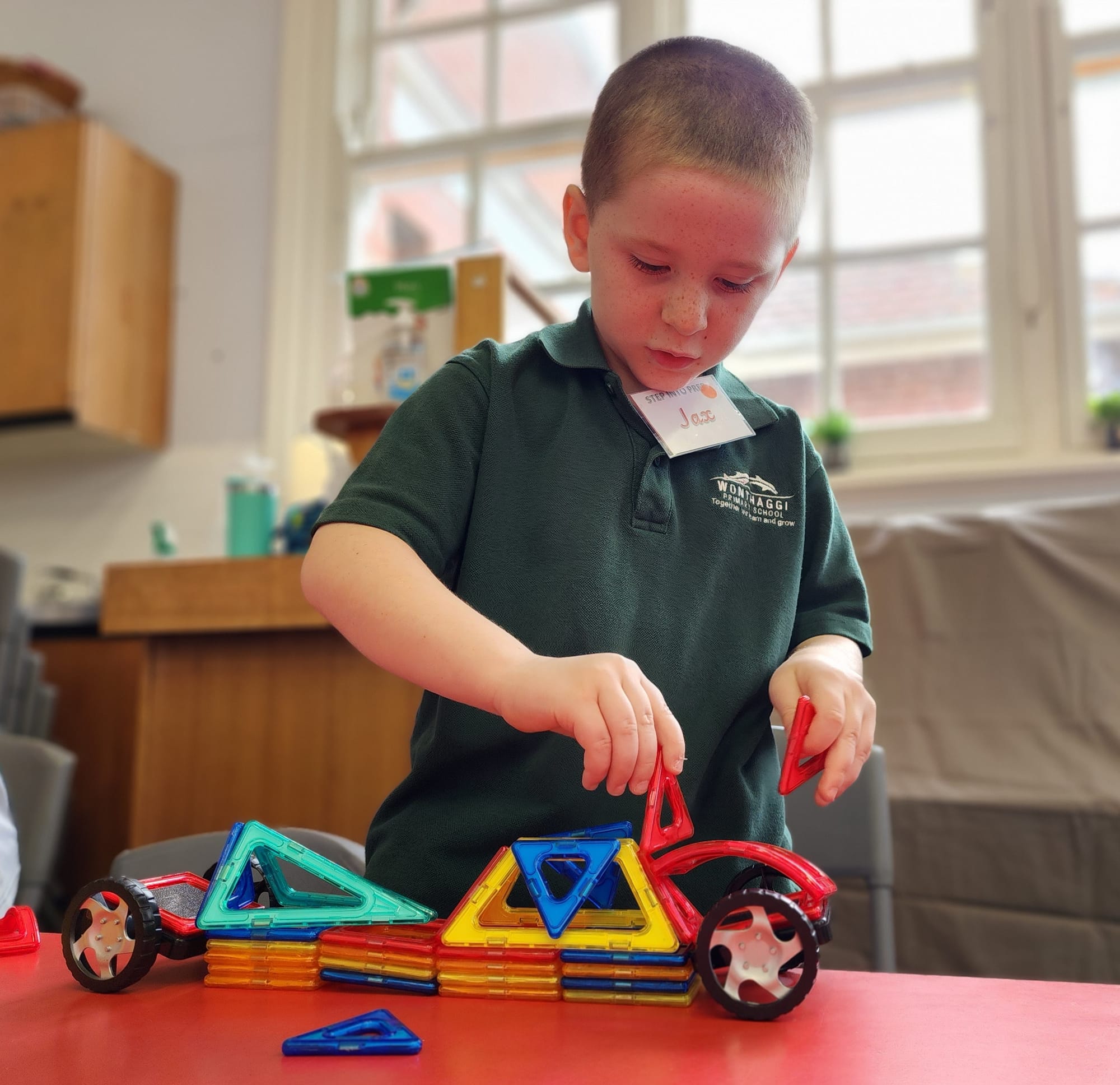 Jax perfects his car design with the magnetic pieces.