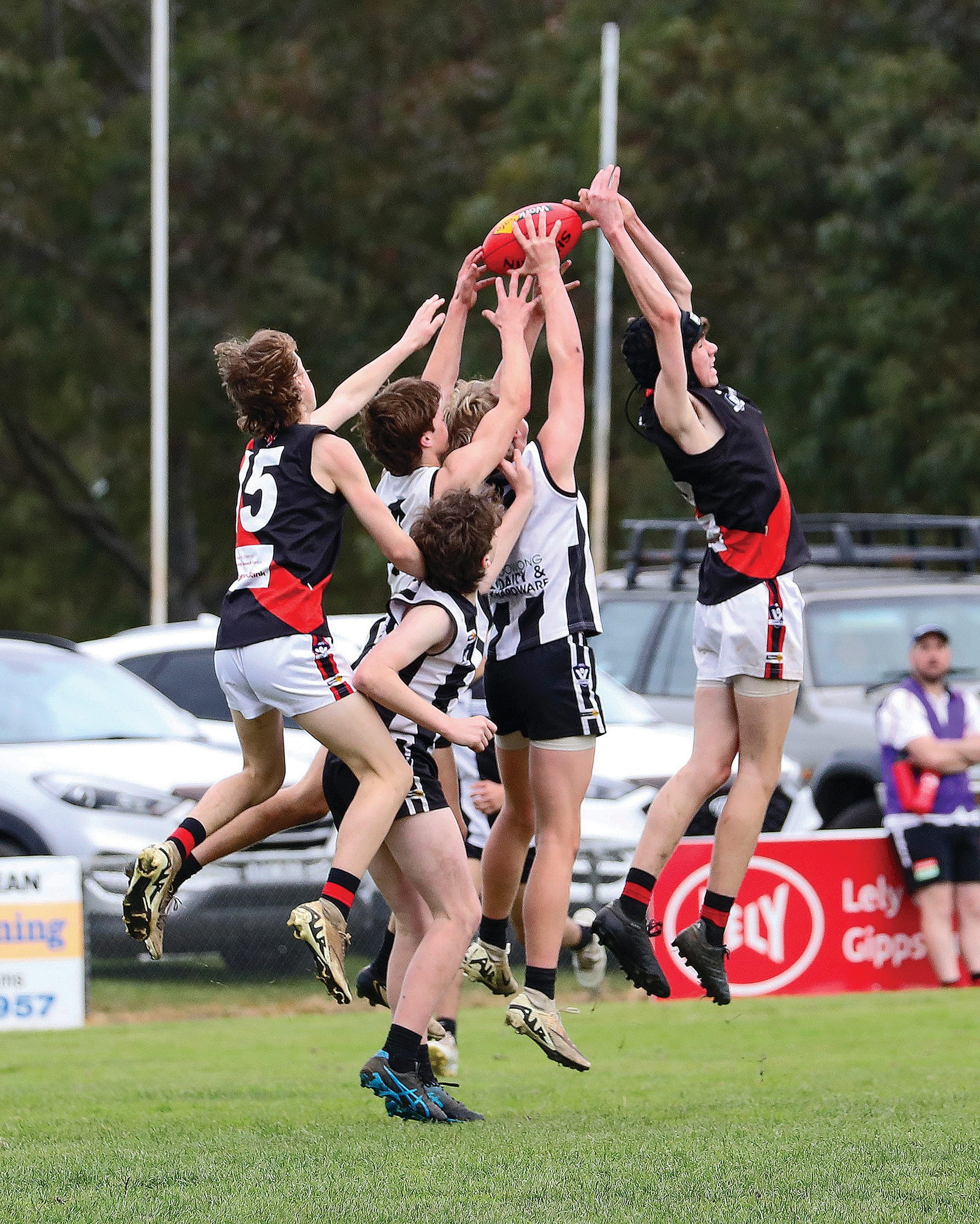Cruze Deal lands the Sherrin for Poowong U16 in a hotly contested pack.
