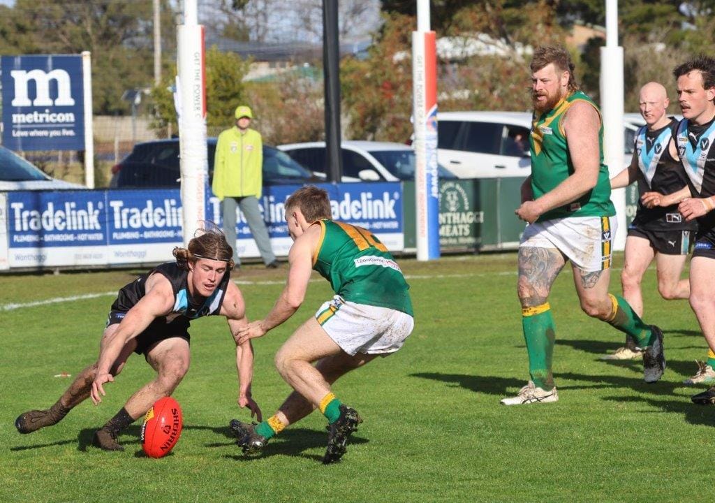 Wonthaggi’s Cade Brown and Leongatha’s Jay Walker go after the loose ball on the Power forward line on Saturday.