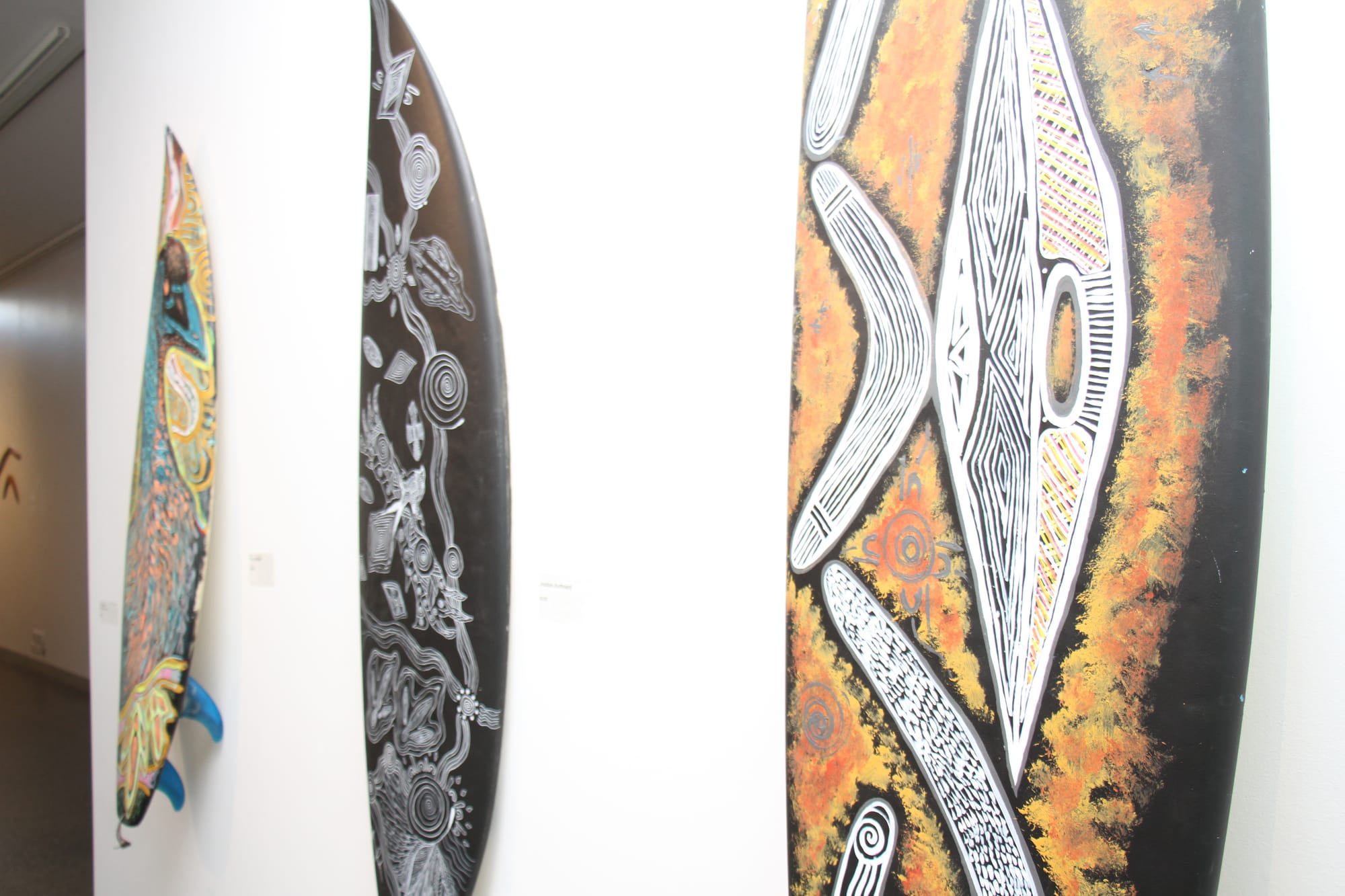 Surfboard designs by Millowl local artist Uncle Steven Ulula Parker. B25_2625
