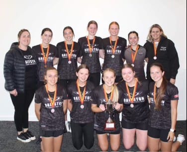 The victorious joint premiers of the 2022 West Gippsland FNC 17 and Under Netball competition, Dalyston, is presented with their premiership cup at last.