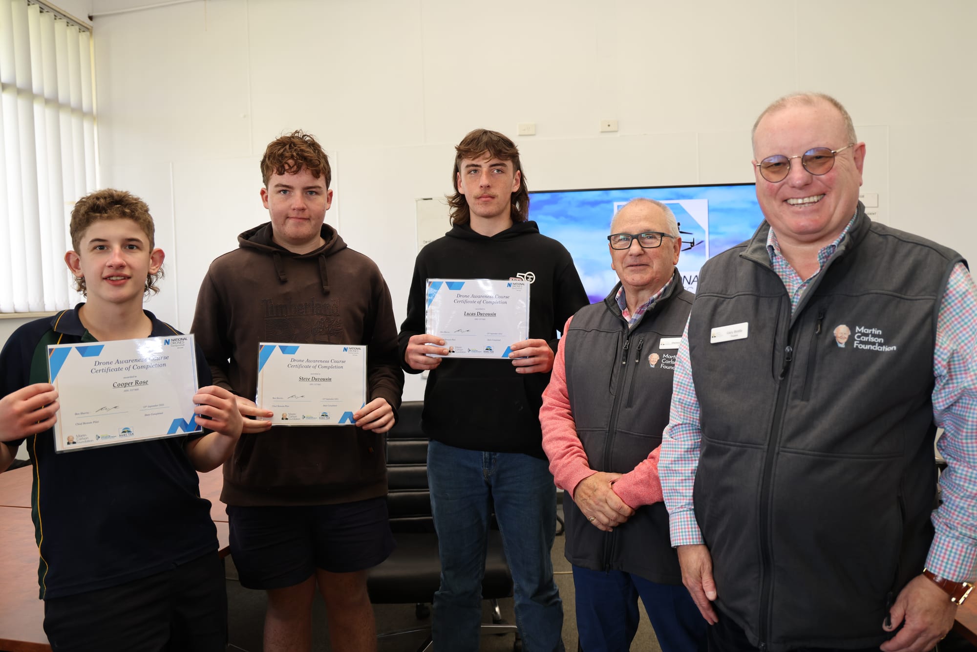 Leongatha S.C. students Cooper, Steve and Lucas receiving their Drone Awareness Course Certificates from Darren Polglaise and Gary Brittle of the Martin Carlson Foundation. B40_3725