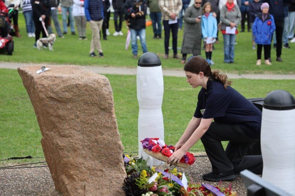 Jazmin Burnett, a Year 9 student at Bass Coast Secondary College, lays a wreath during the San Remo Anzac Day service.