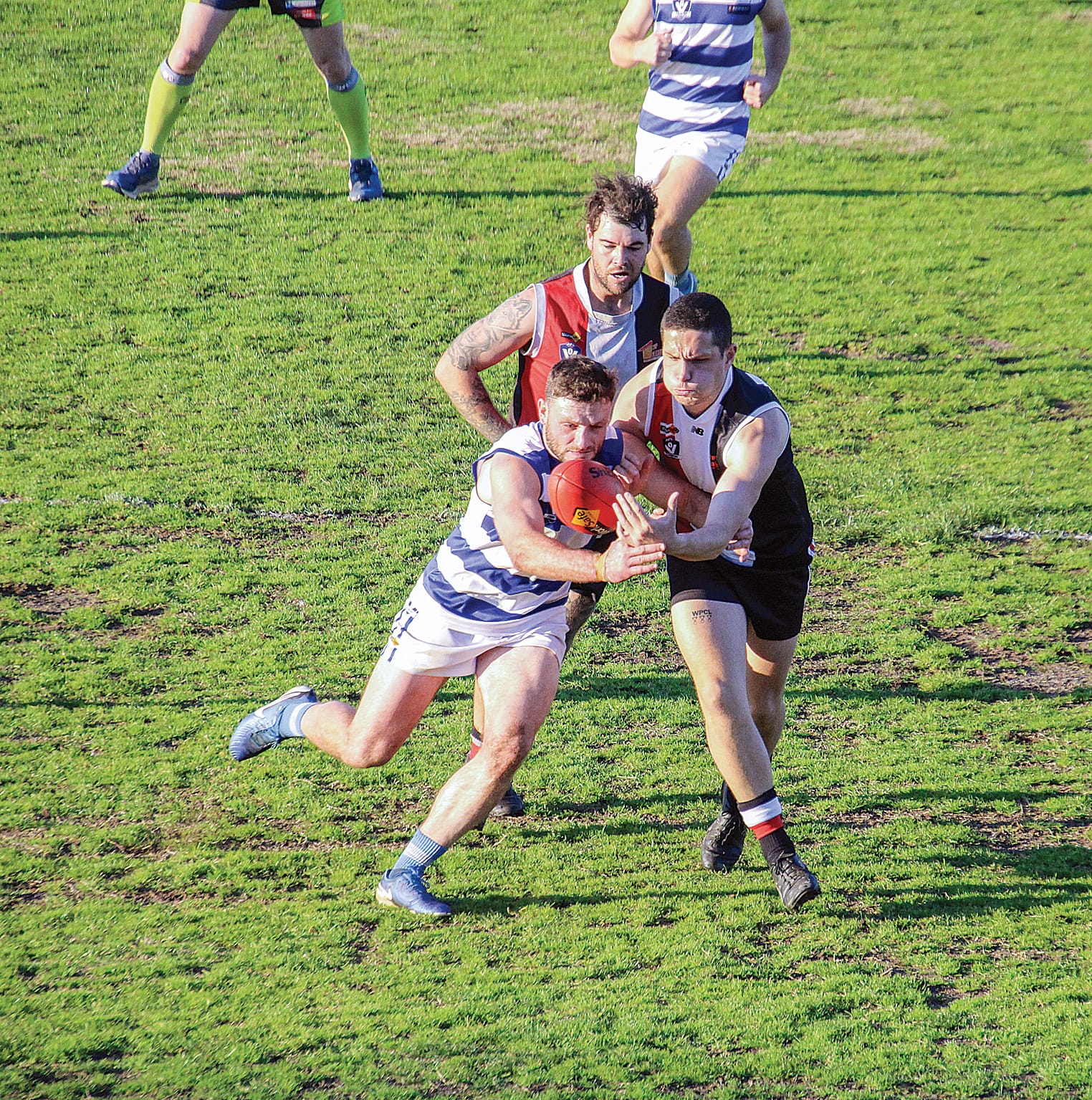 Fletcher Kennedy pressures his Neerim opponent with Jordan Anderson in support.