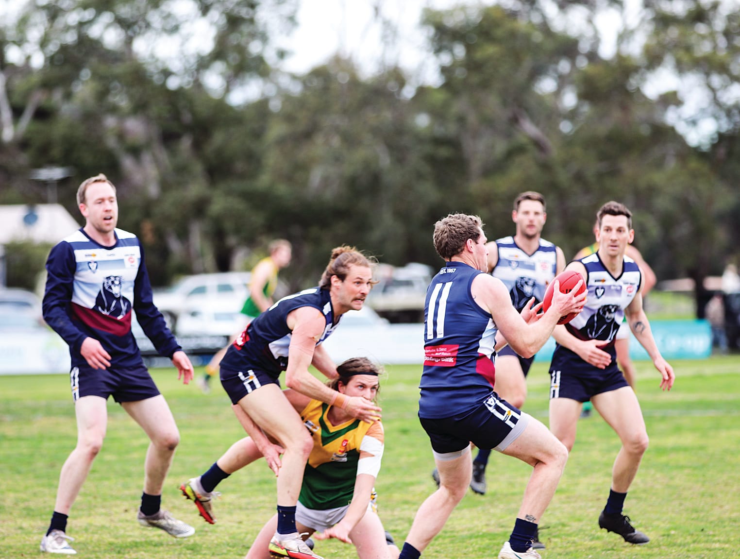 Kilcunda Bass play with strong pressure against Garfield in the first half with Daniel Mock safely getting the ball out into their 50. Z50_3322.  