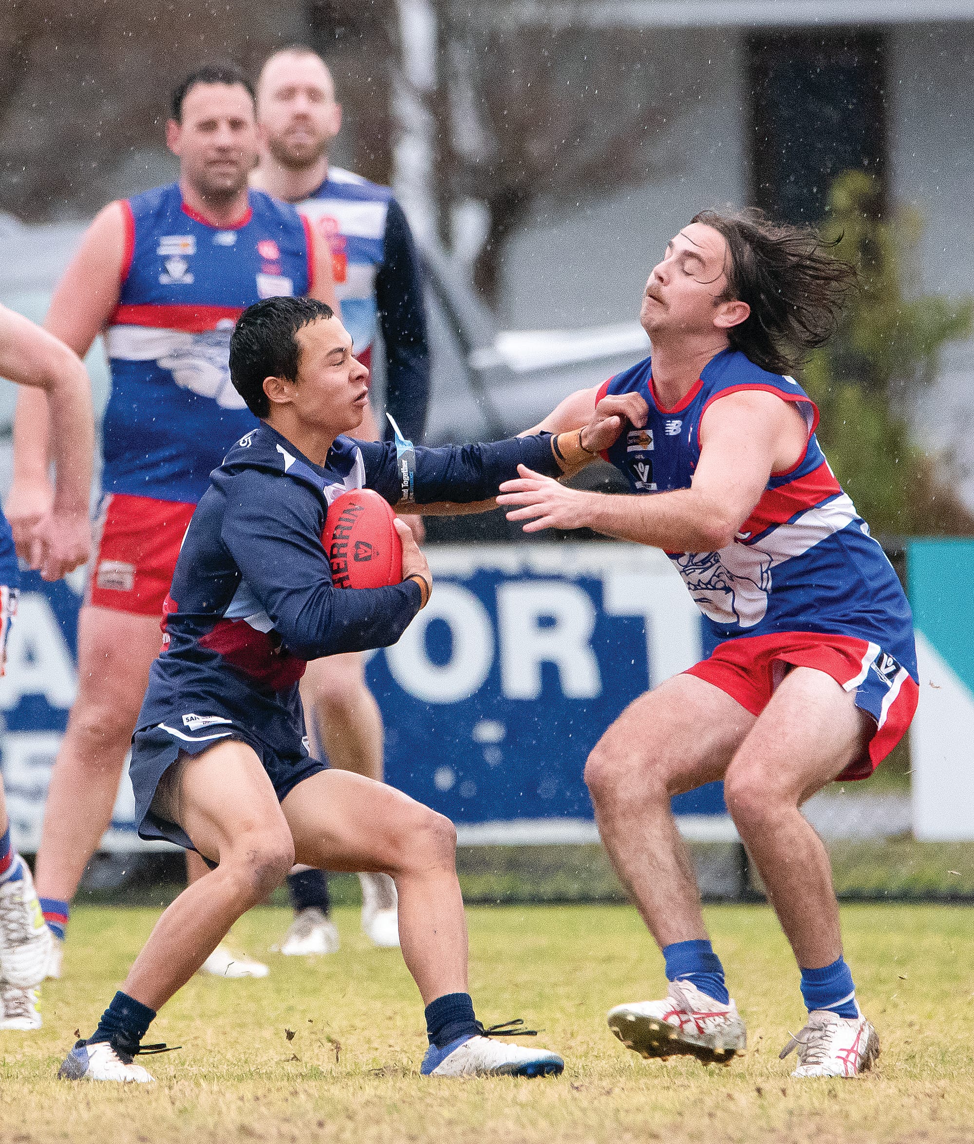 Jed Rosenow runs into traffic, fending off Ben Taylor as he searches for an option.