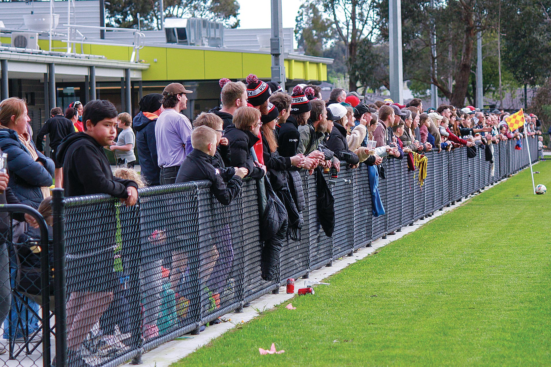 Spectators line the pitch throughout the day.