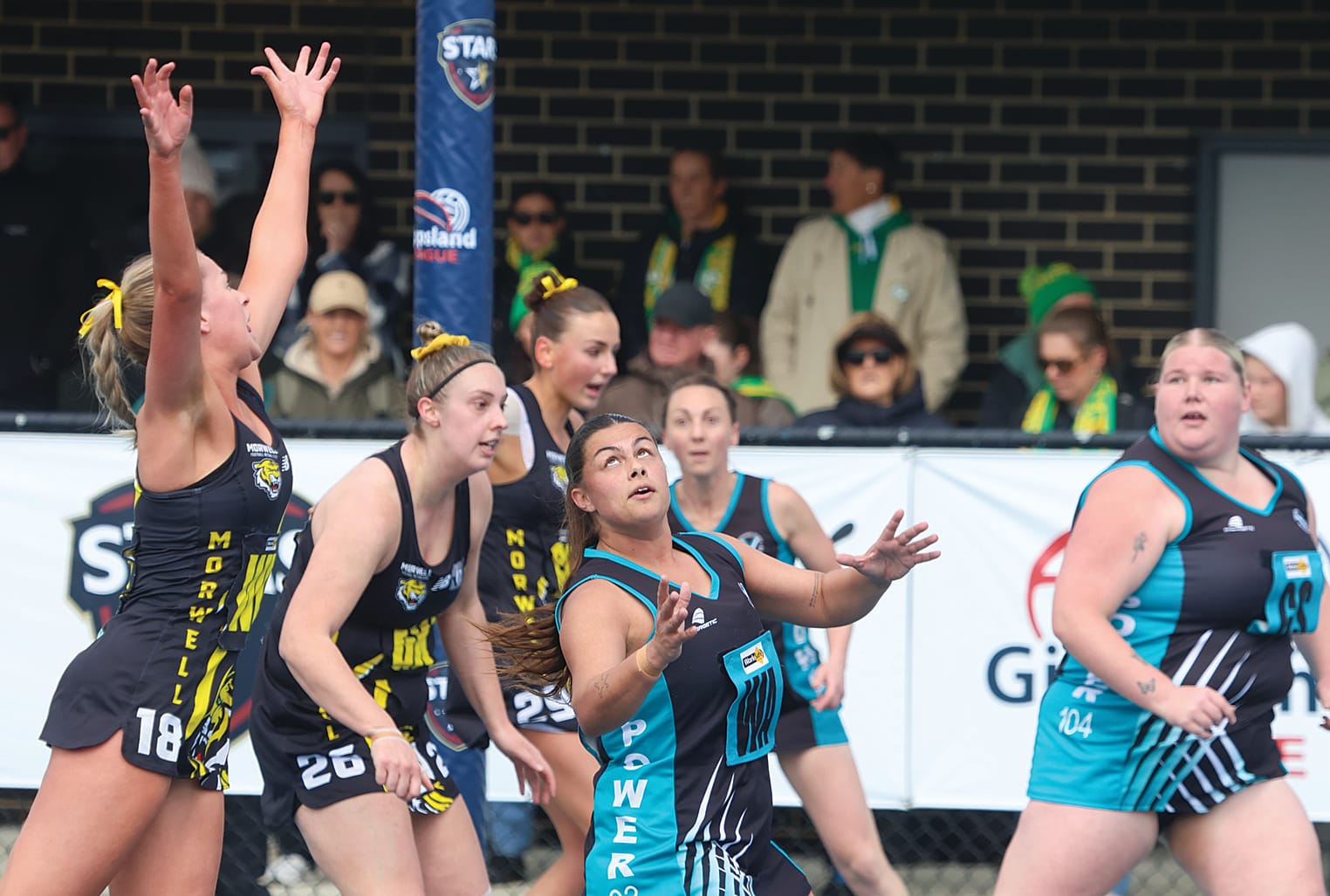 Isabella Tiziani has eyes only for the ball in this contested situation during Saturday’s C Grade grand final.