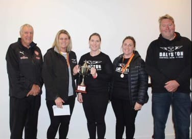 West Gippsland FNC Advisory Committee Member Colin Rielly presents the 17 and Under joint premiership cup to Dalyston for the Under 17 netballers. Pictured L-R Col Rielly, Saskia Schmidt (co-coach), Oona Shepherd (president netball), Paige Tait (co-coach), and Andy Thomas (Dalyston FNC) president.