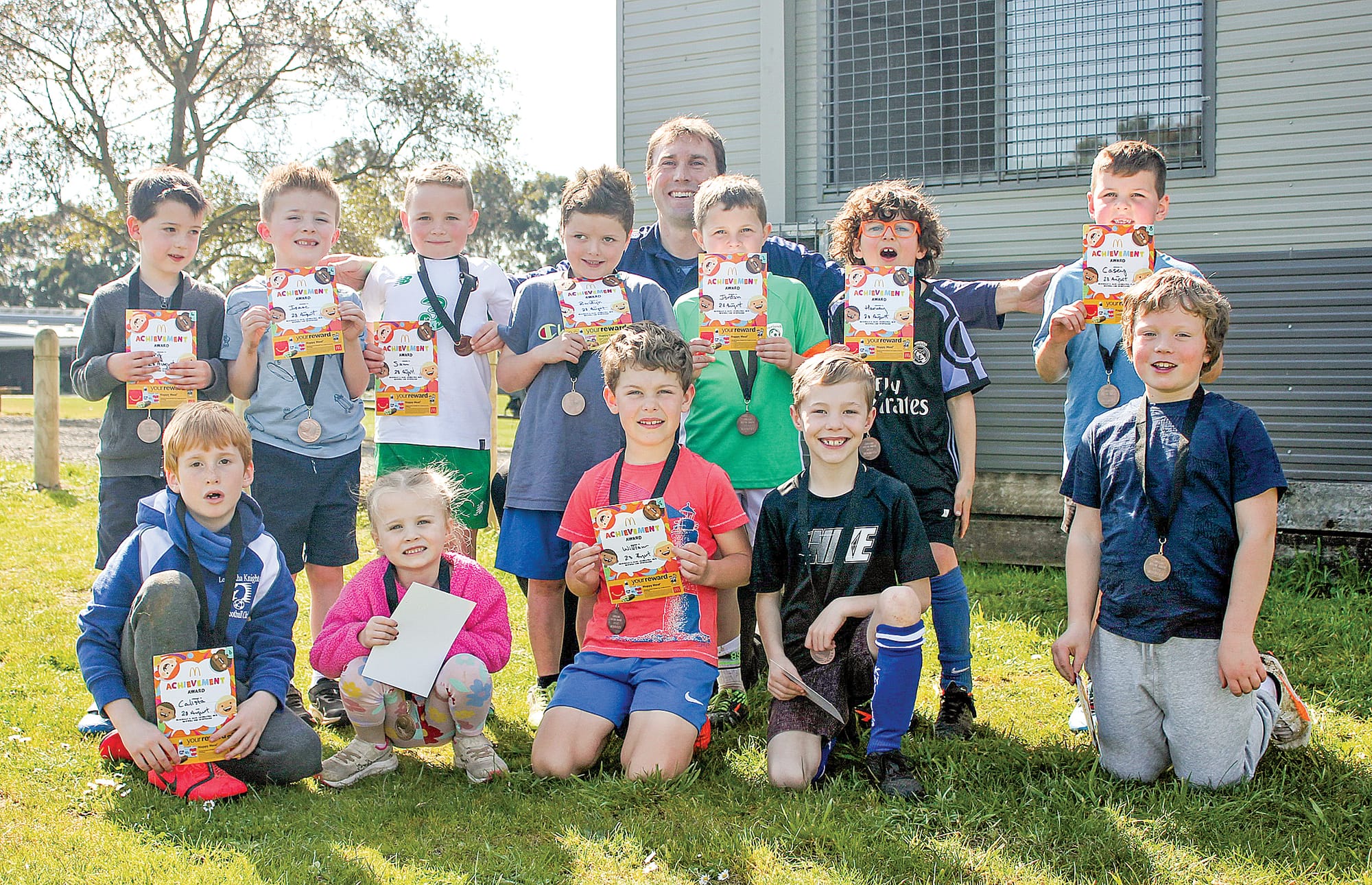 The ‘Mini Roos’ under 6s and 8s with coach Mike.