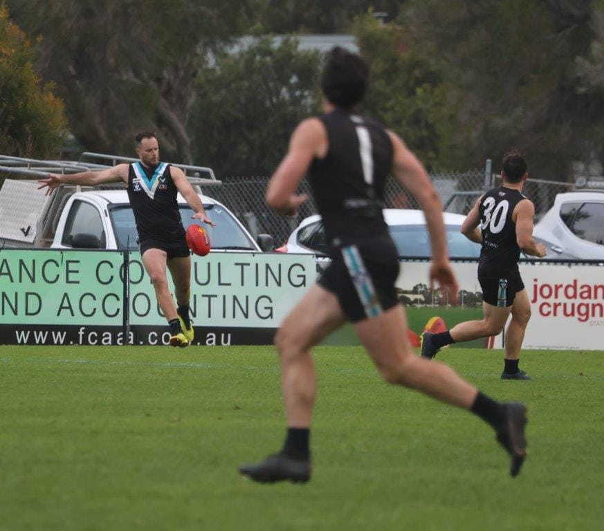 Former Collingwood champ Nathan Brown spots up Shannon Bray on the move forward during a consummate display by Wonthaggi on Saturday.