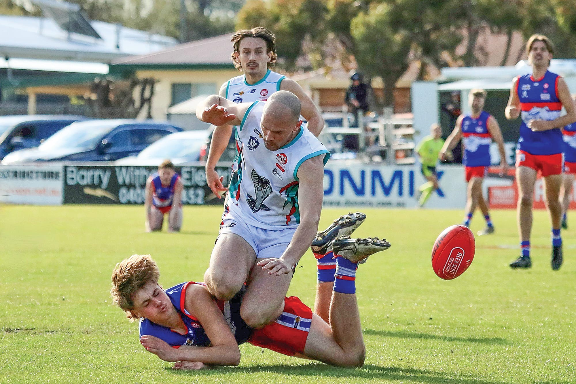 Jack Huther takes a hard tackle to the ground from Cora Lynn. Photo: Carol Ratcliff.