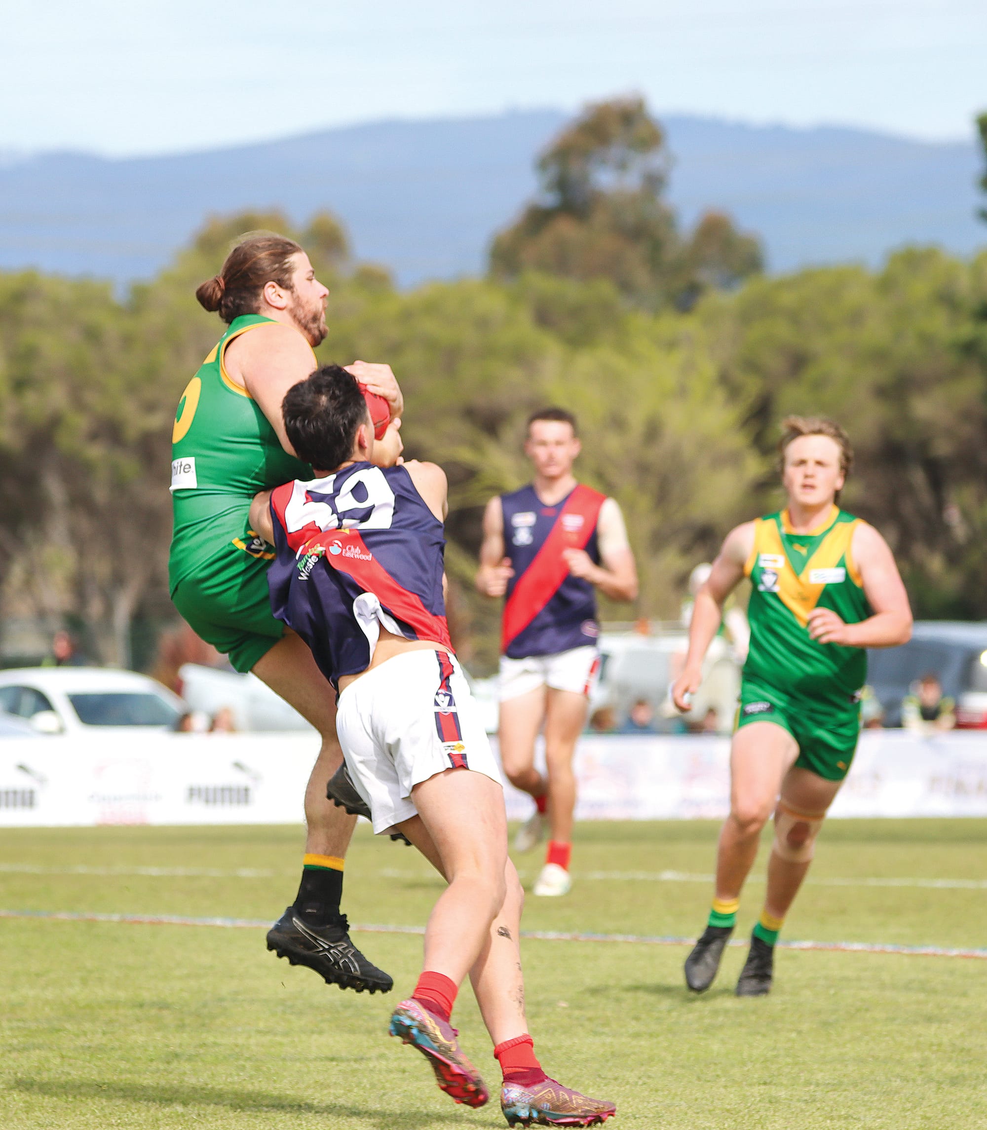 Flynn Materia of Leongatha marks during the final quarter of the Reserves despite the attention of Bairnsdale’s Tyson Matthews. A51_3924
