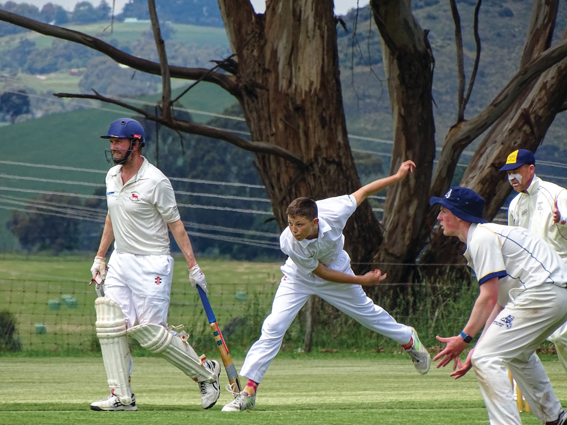Koonwarra/Leongatha RSL’s Louis Reid sends down a delivery with Will Cashin on standby, ready to catch. Photo: Jodie Arnup.
