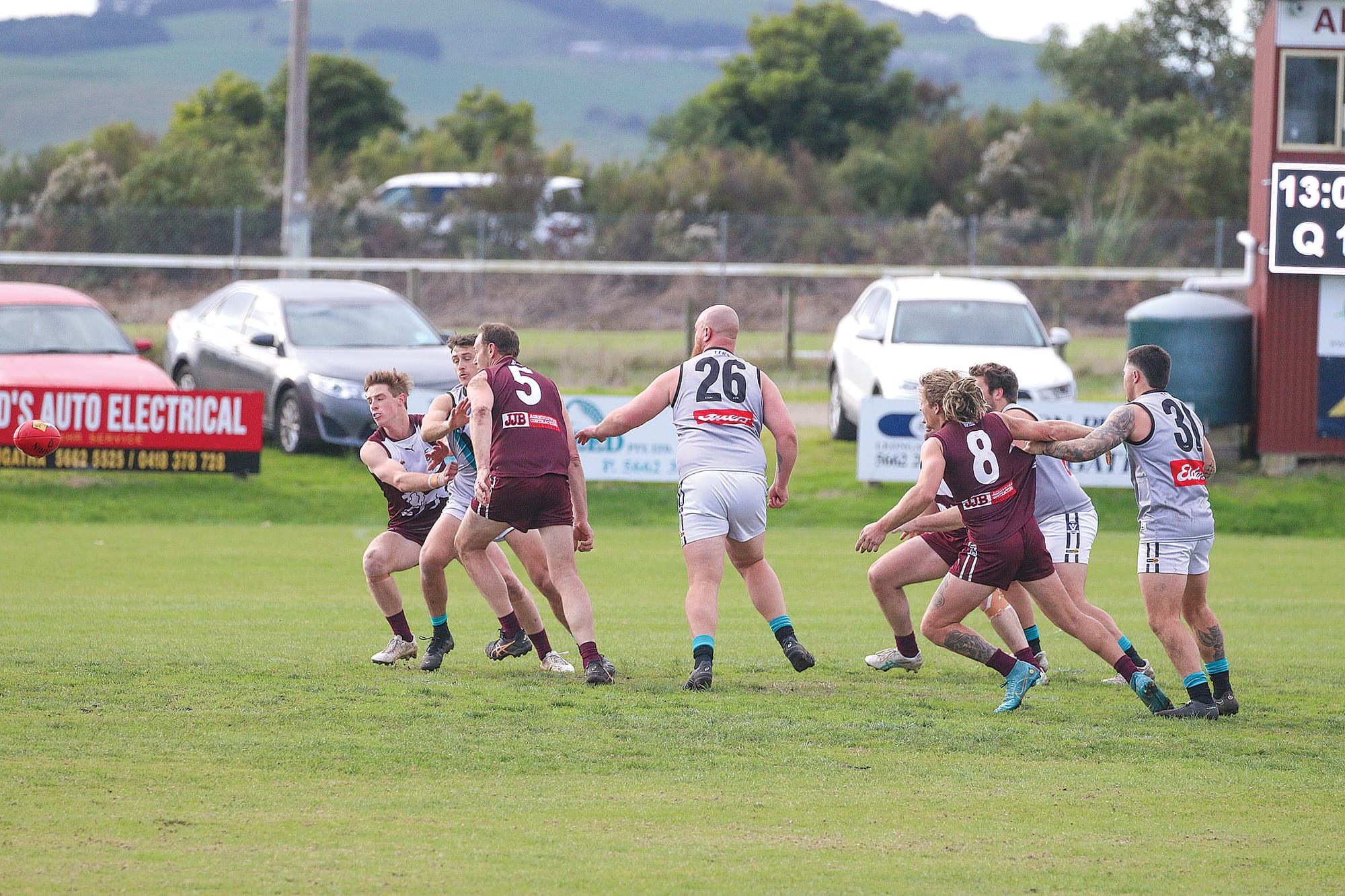All eyes are on the ball as the teams battle it out from the scrum. 