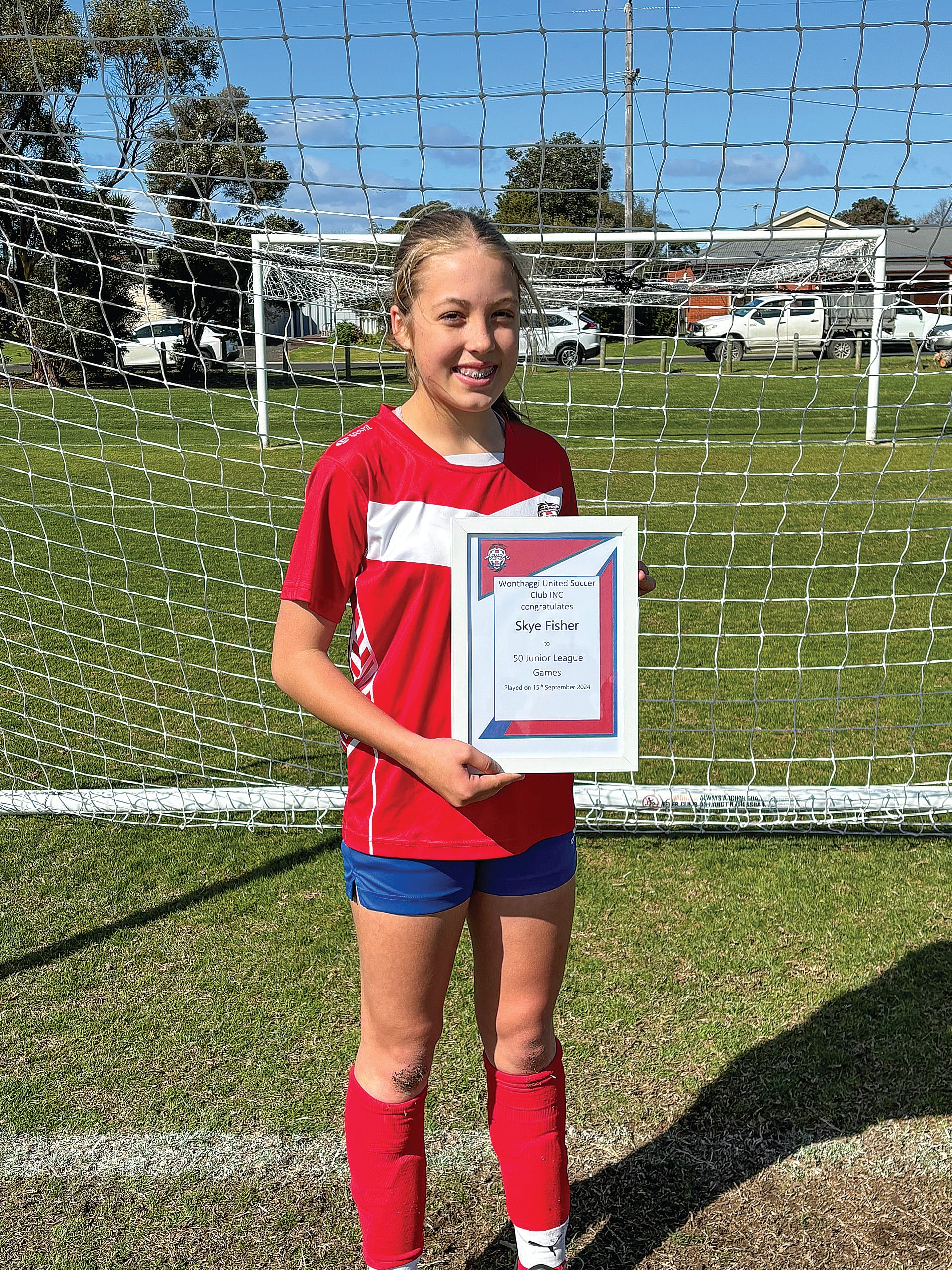 Skye Fisher was presented with her 50 junior league games certificate on Sunday for Wonthaggi United. 