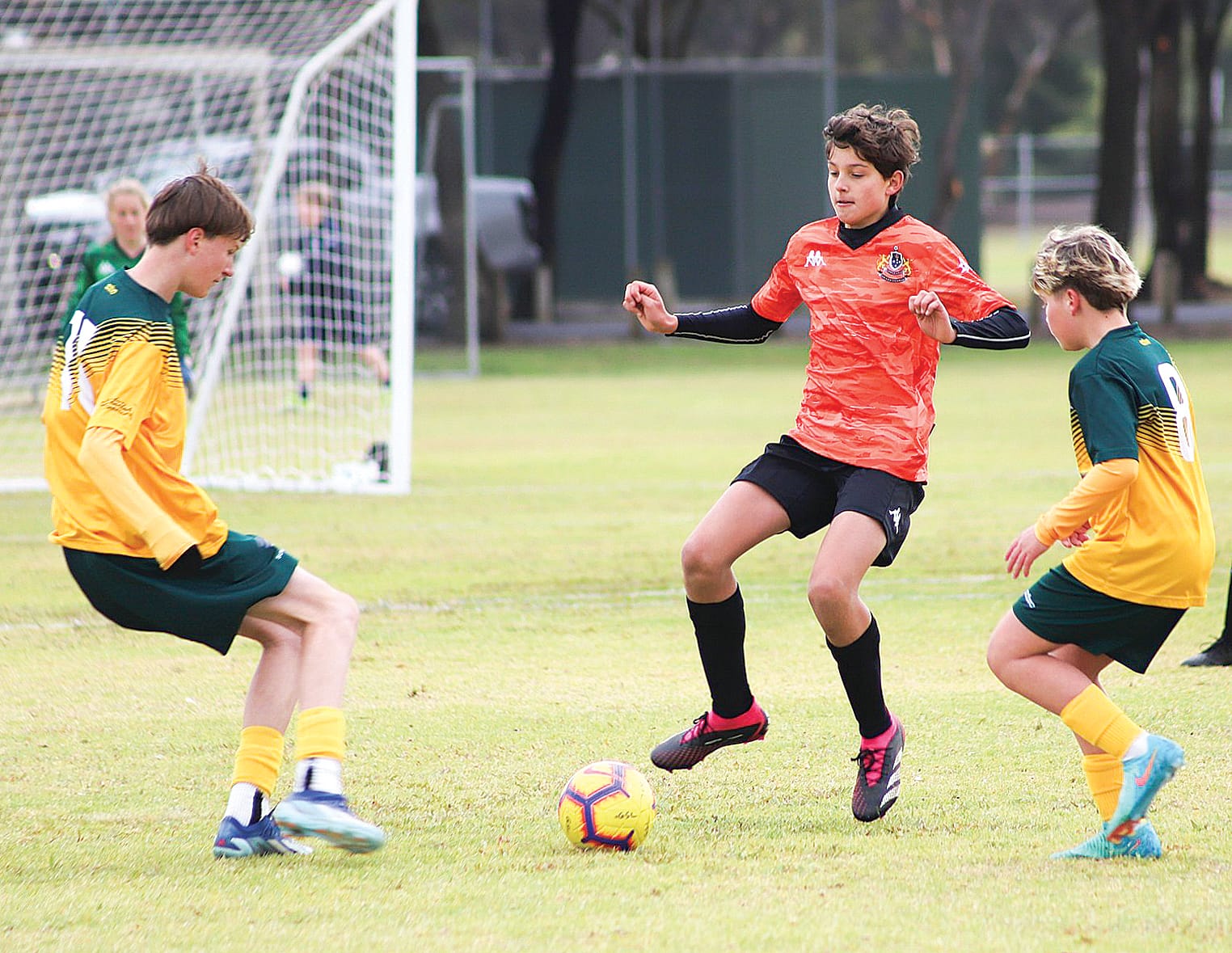 GSL U15 Boys Tony Bals surrounded by Sunryasia opponents.