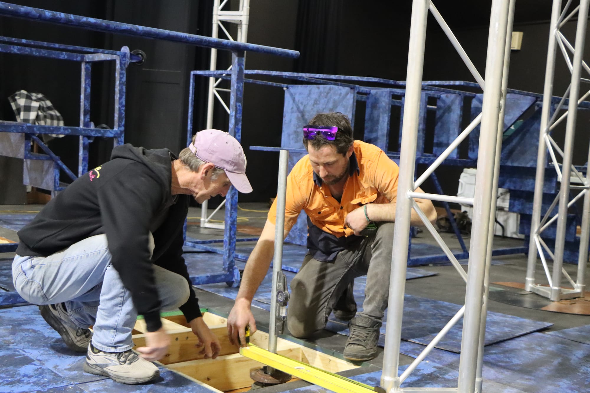 Construction coordinator Mark Harrison and set builder Michael Daniel make sure everything is perfect.