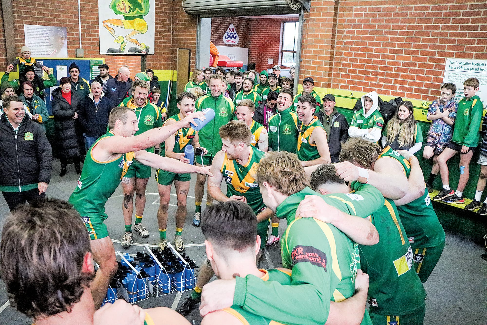 Leongatha captain Tom Marriott makes sure there is no escape for teammate Matt Borschman who has just played his 100th senior game. A22_2524