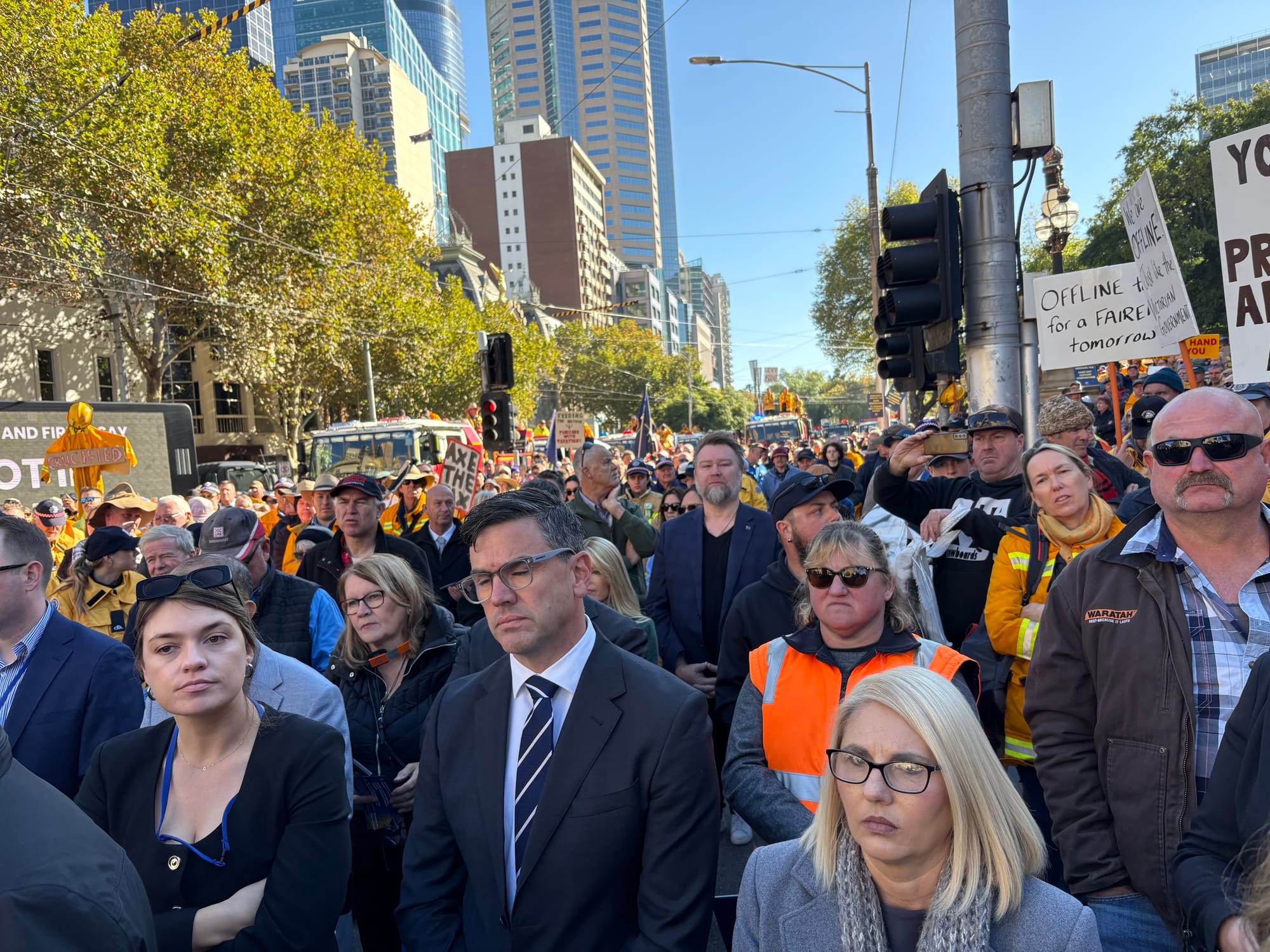 Protesters stand against the planned Emergency Services and Volunteer Fund.

