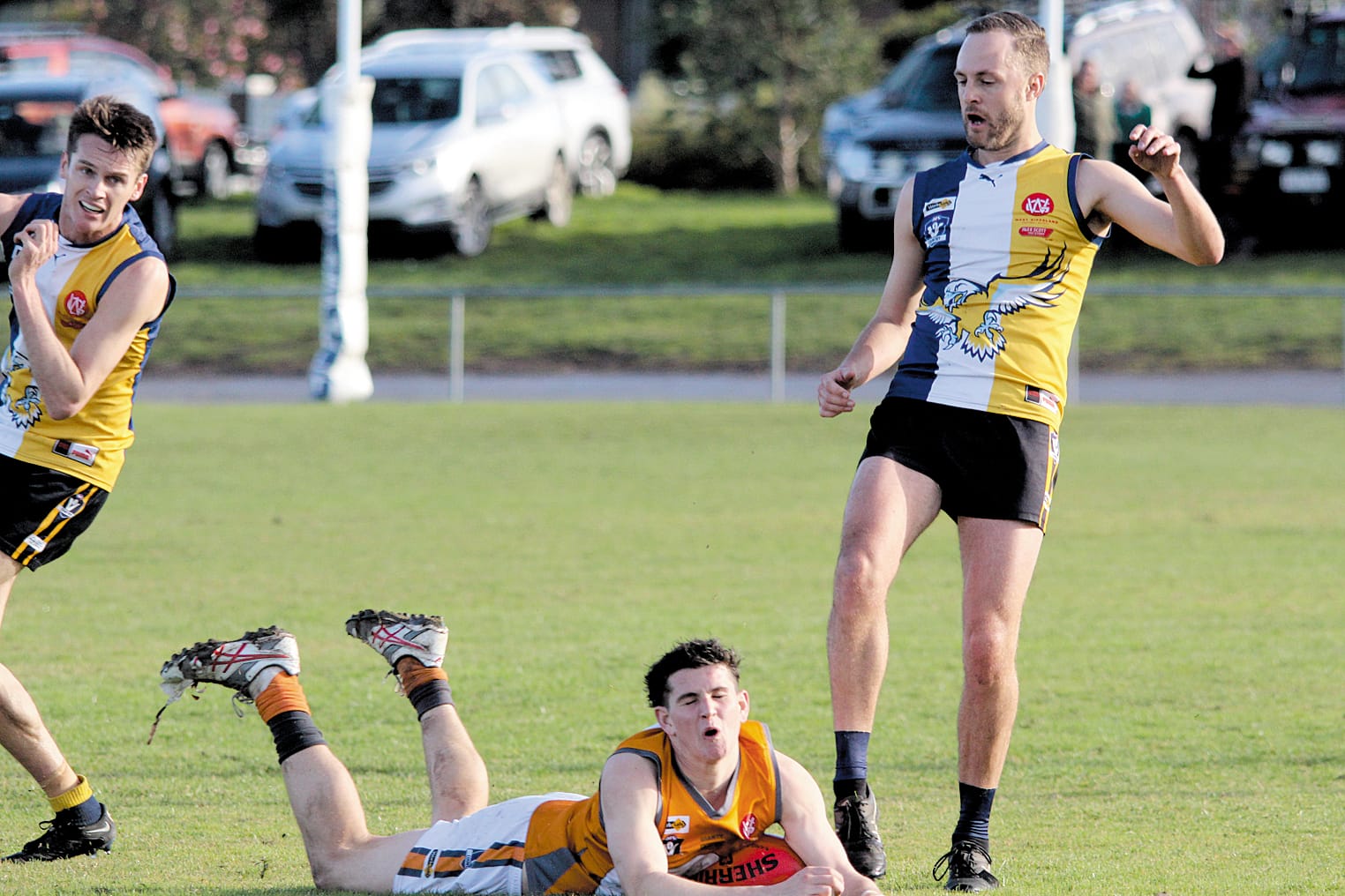 Korumburra Bena’s Joel Cuman with a huge smother off the boot of Todd Mackie. 
