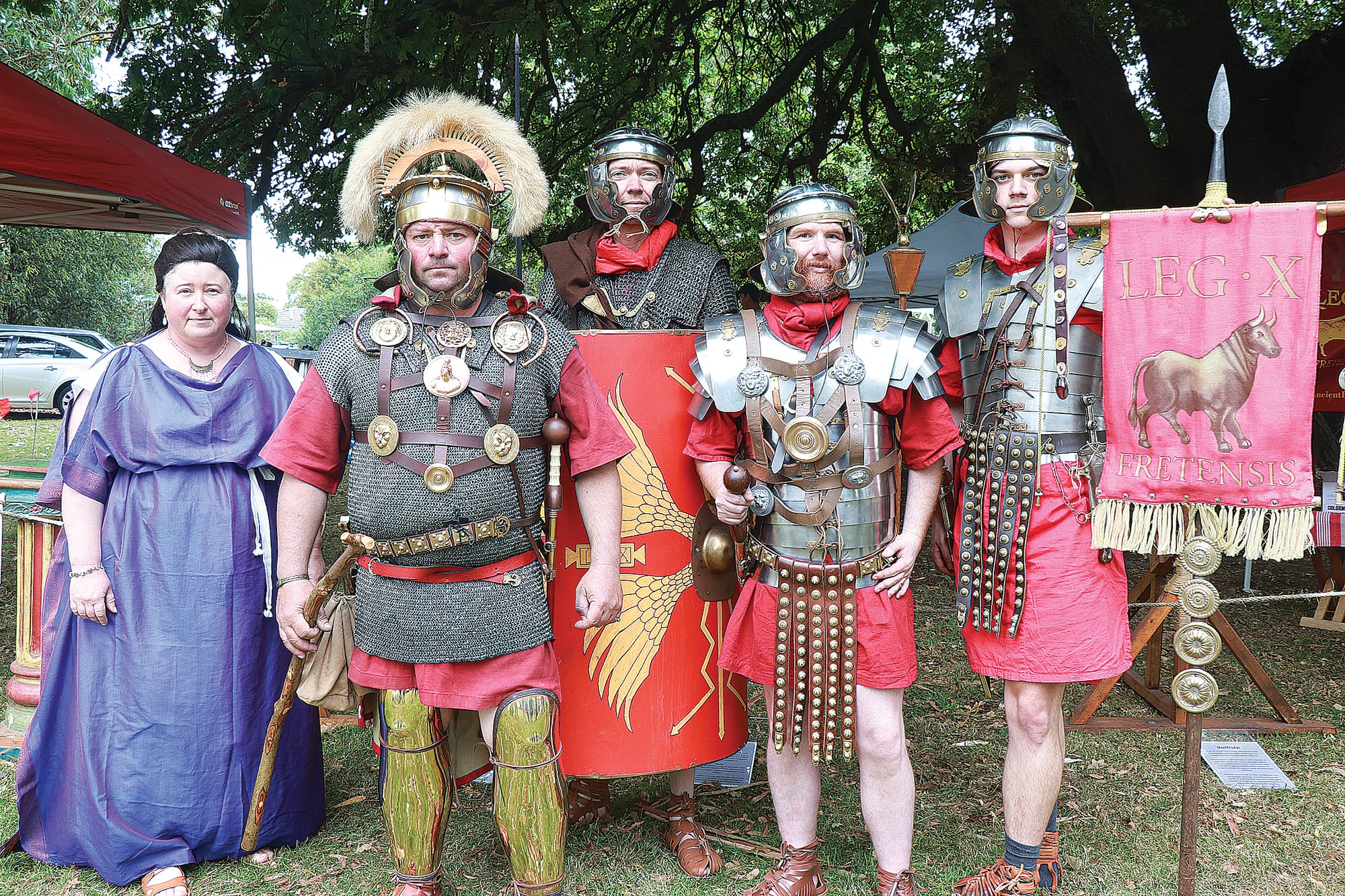 Barbara, Robert, John, James, and Jordan of the Ancient Roman Reenactors Victoria are enthusiasts of ancient Roman history, showcasing the tools and culture at the Italian Festa in 2024.