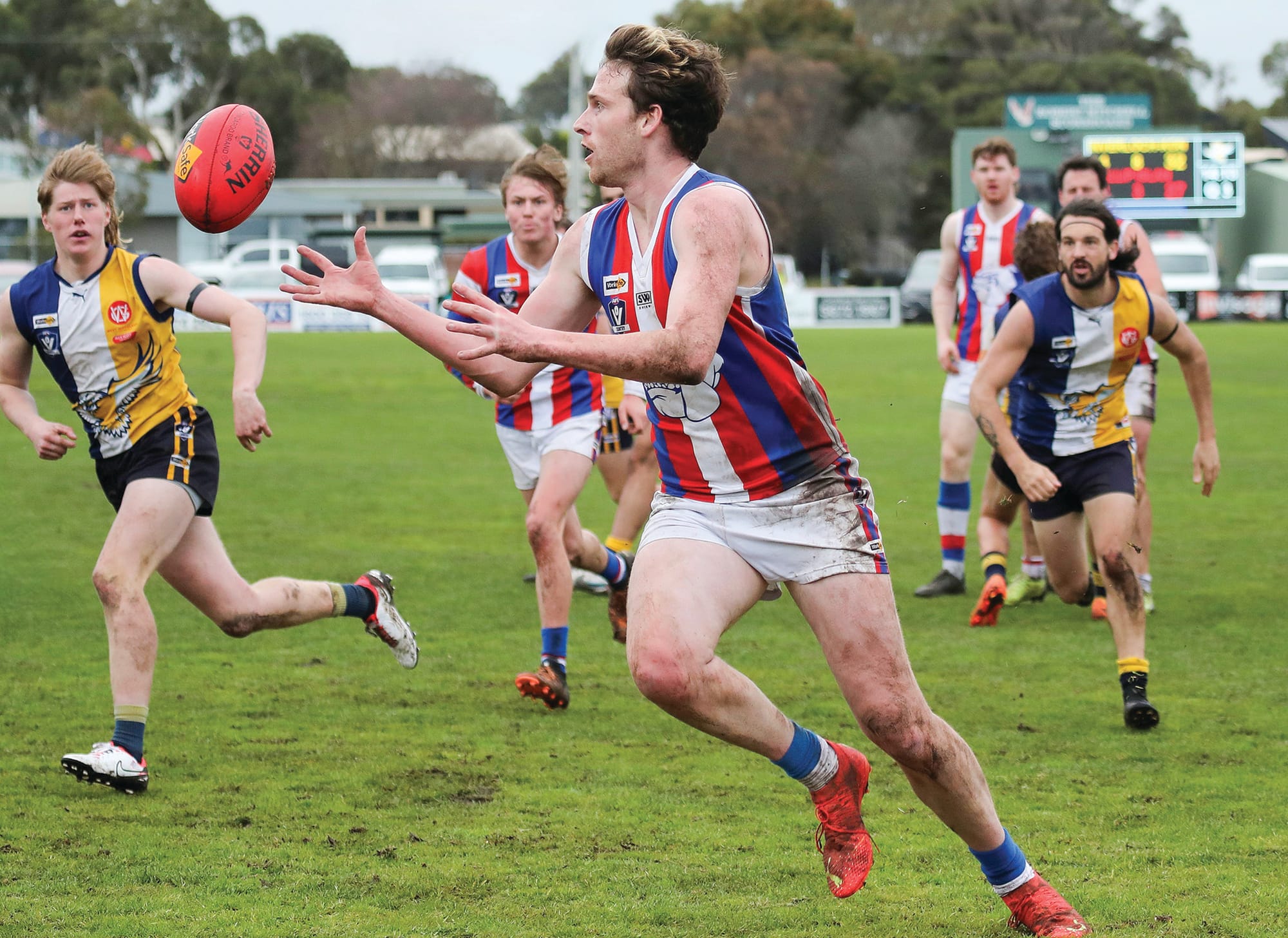 Phillip Island seniors Jordy Patullo takes possession of the ball in Saturday’s draw. Photo: Carol Ratcliff.