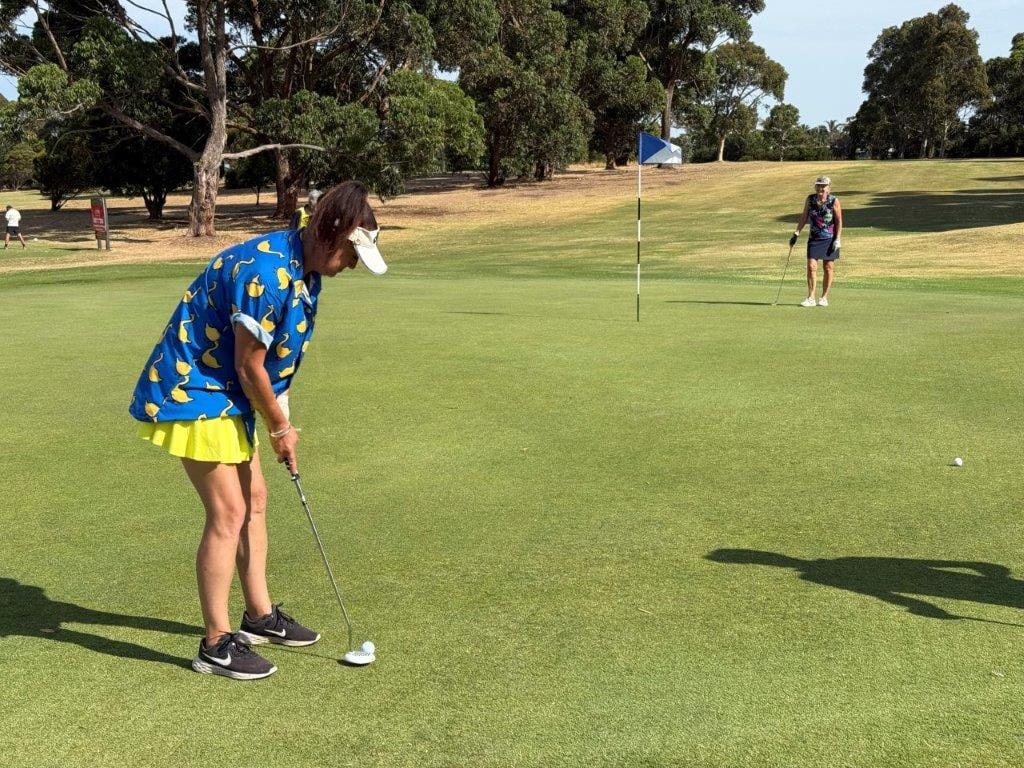 Layla Robinson puts out at the end of another of her 18-hole rounds for the Cancer Council last Sunday.