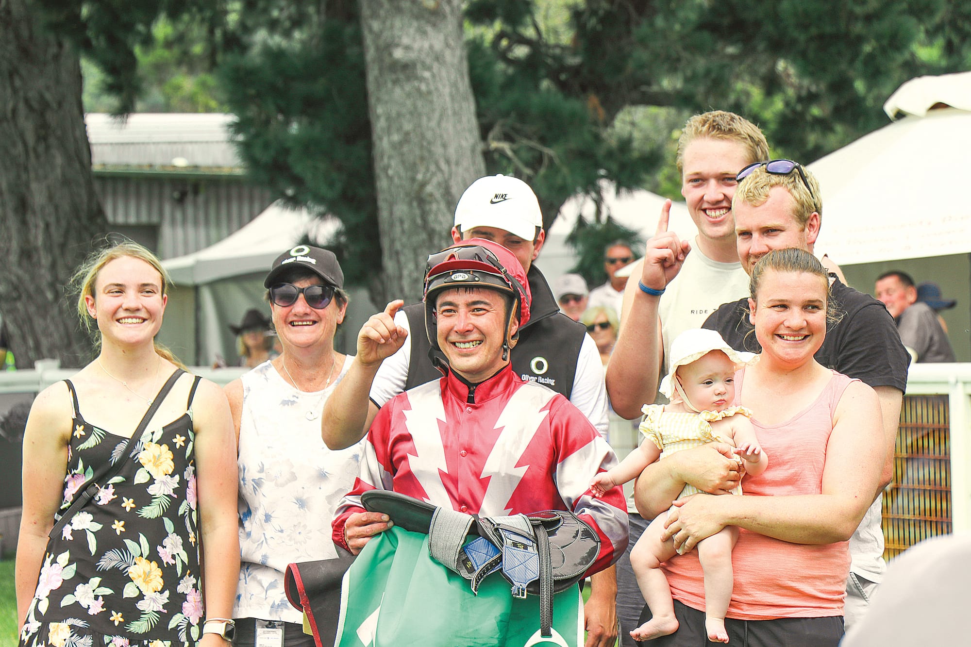 Jockey Shaun Cooper celebrates his win of the 2023 Woolamai Cup with owner Lachlan and family, and friends. Z21_0523