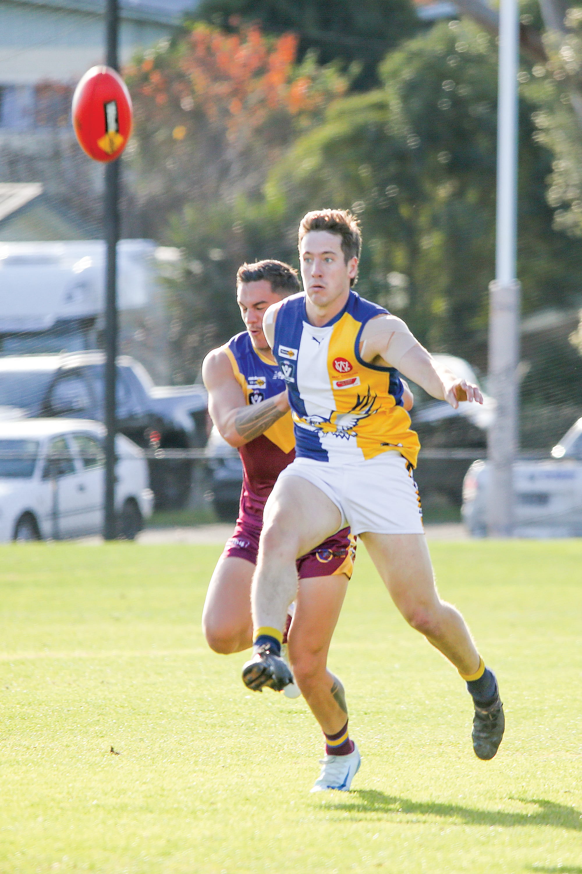 Jamieson Soumilas gets it out under pressure from Warragul. Photo: The Warragul and Drouin Gazette. 
