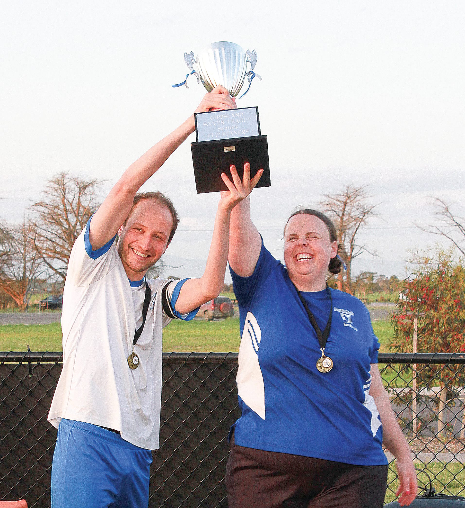 Leongatha’s premiership captain Sven Gebele and coach Bethany Milkins with the cup.